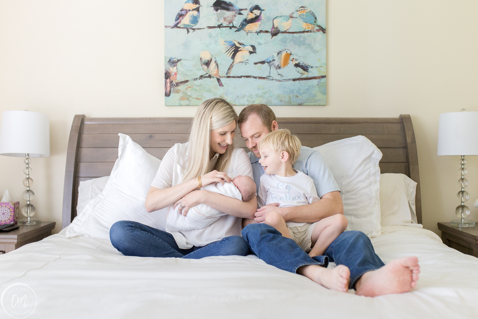 Family on bed during Charleston lifestyle newborn session | Caitlyn Motycka Photography