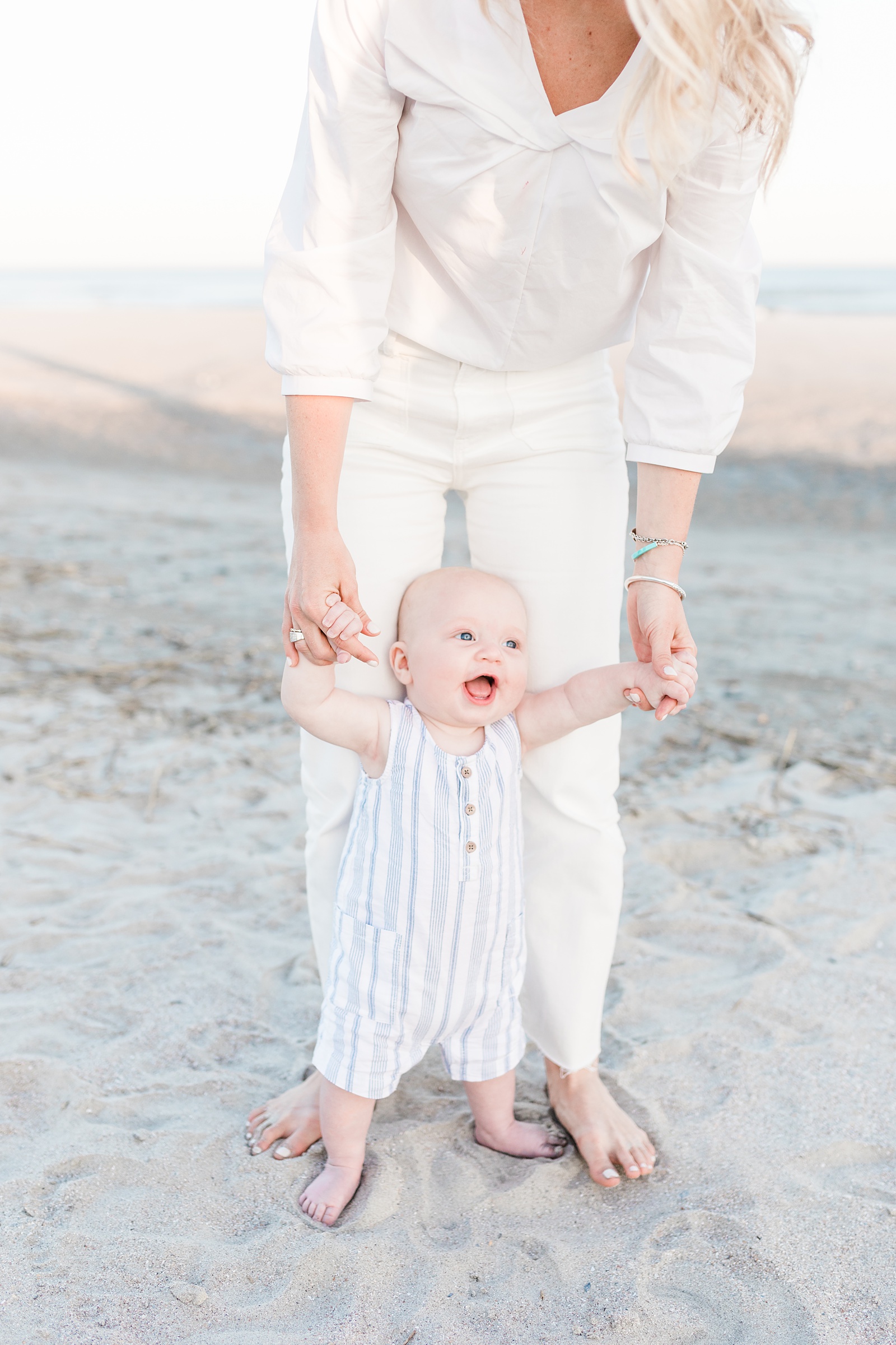 Infant on beach during extended family session on Isle of Palms beach by Charleston Family Photographer, Caitlyn Motycka Photography