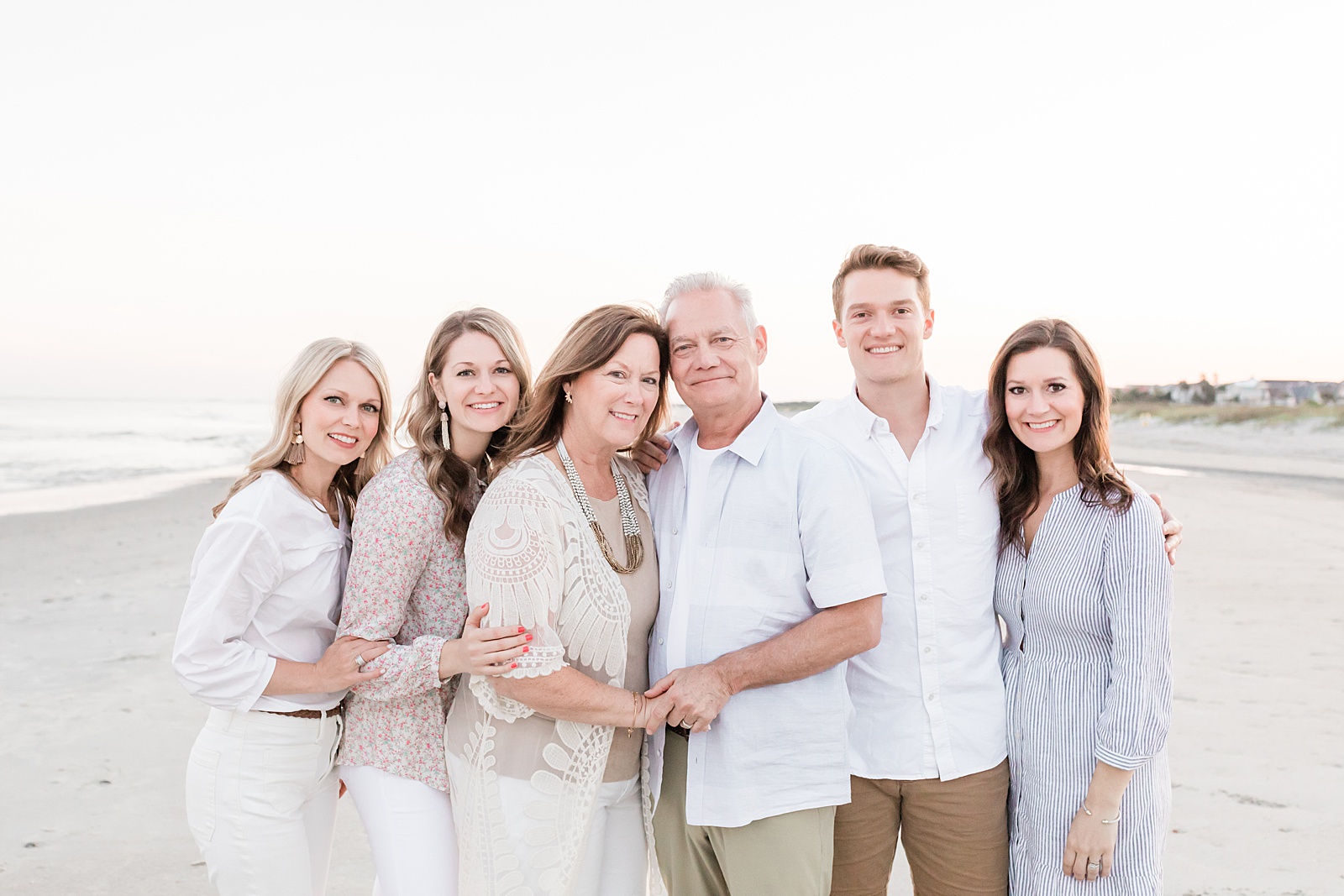 Parents with four kids on beach during Extended family session by Charleston Family Photographer, Caitlyn Motycka Photography