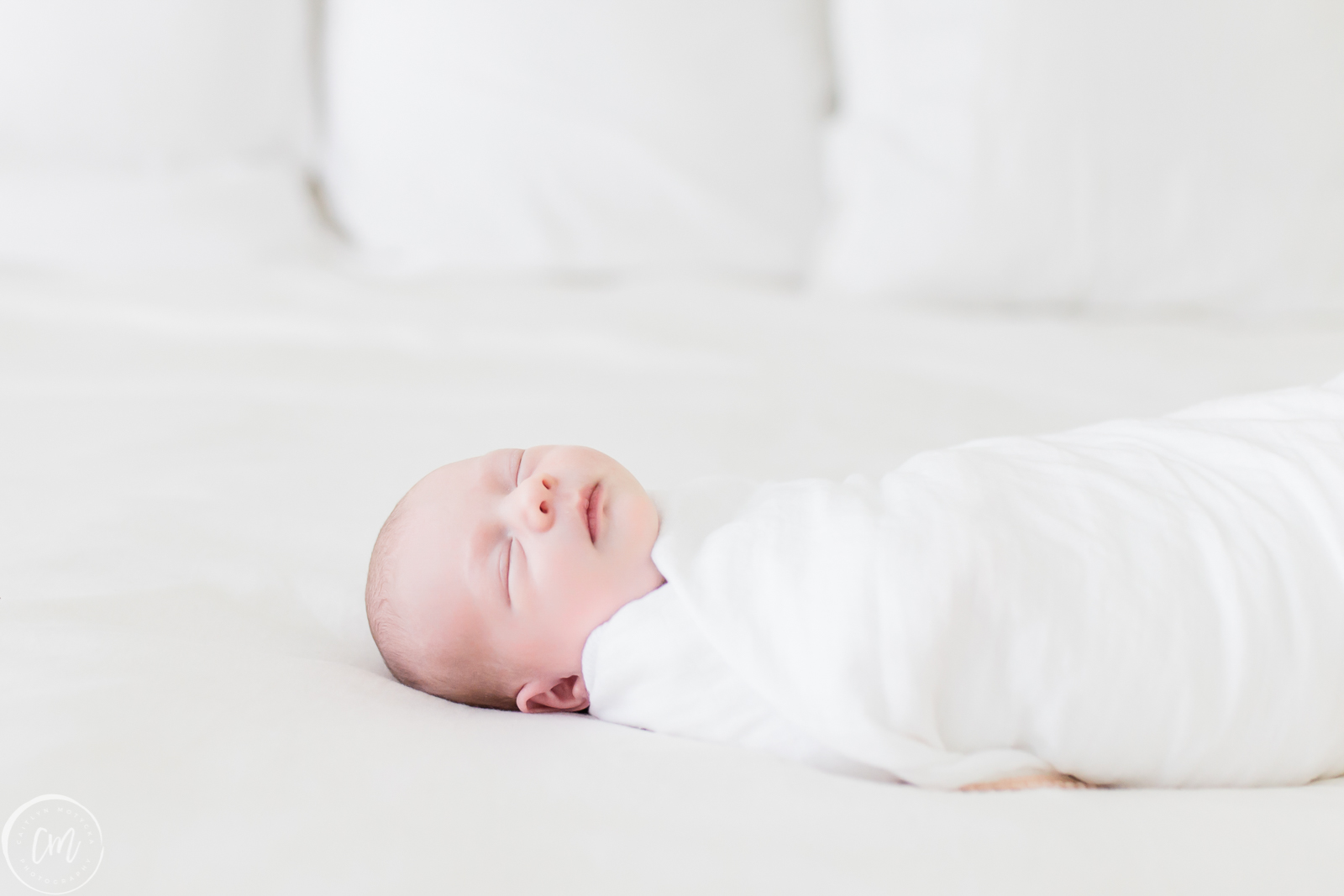Baby girl during lifestyle newborn session with Charleston Newborn Photographer, Caitlyn Motycka Photography