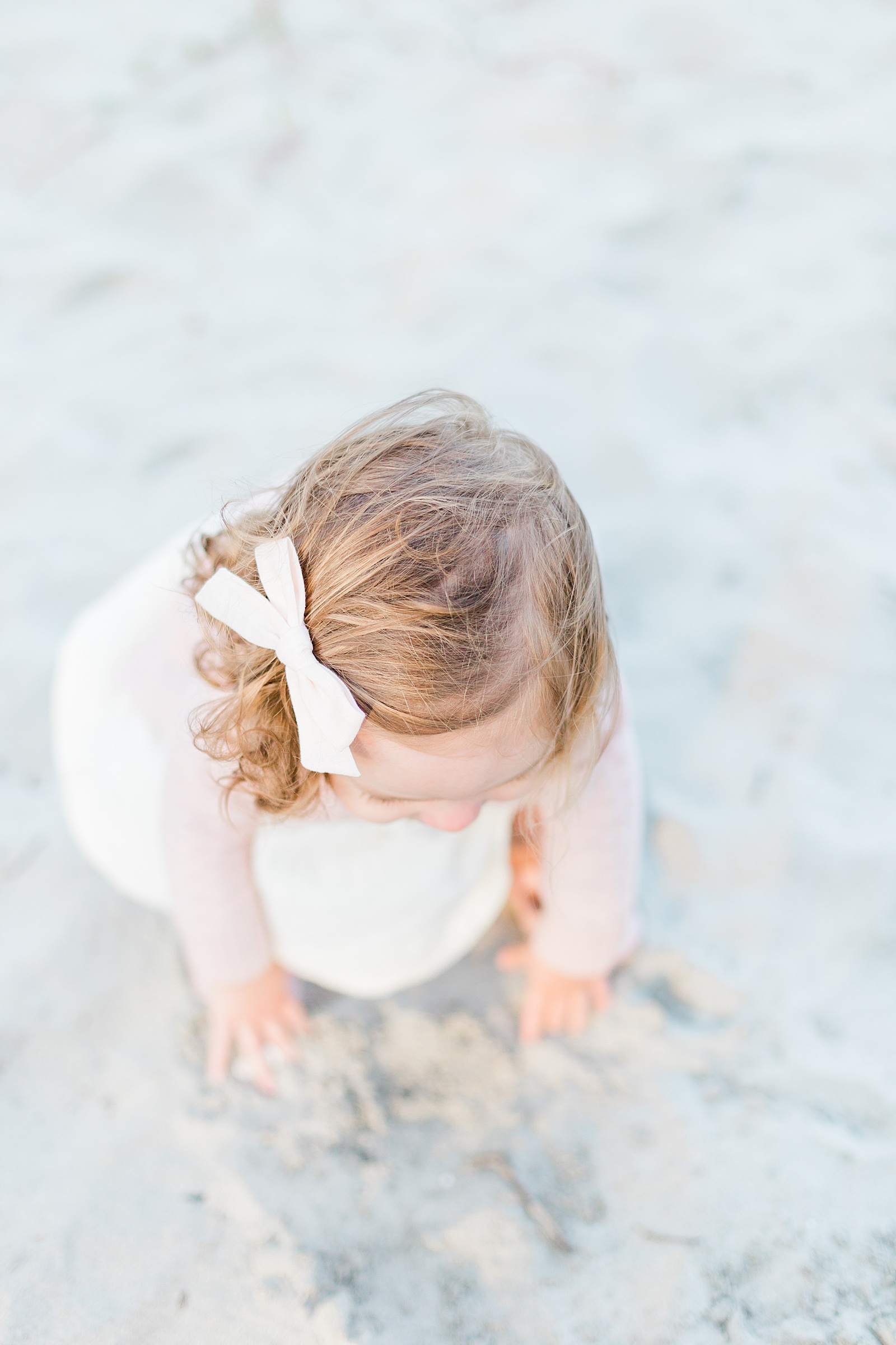 Toddler plays in sand on Folly Beach | Caitlyn Motycka Photography