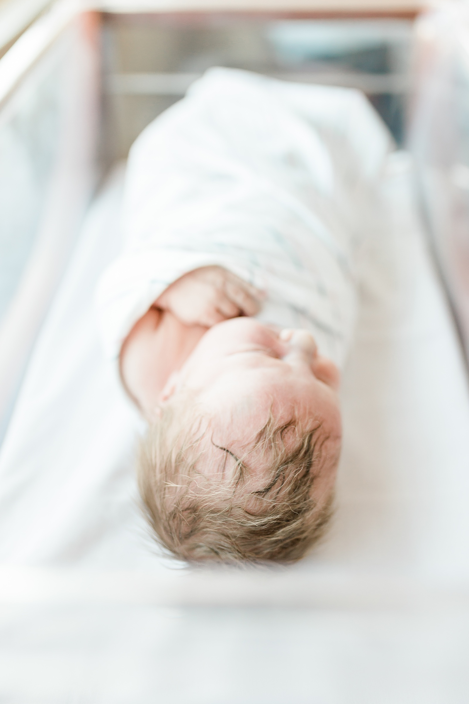 Newborn in hospital bassinet in Fresh 48 hospital session | Caitlyn Motycka Photography