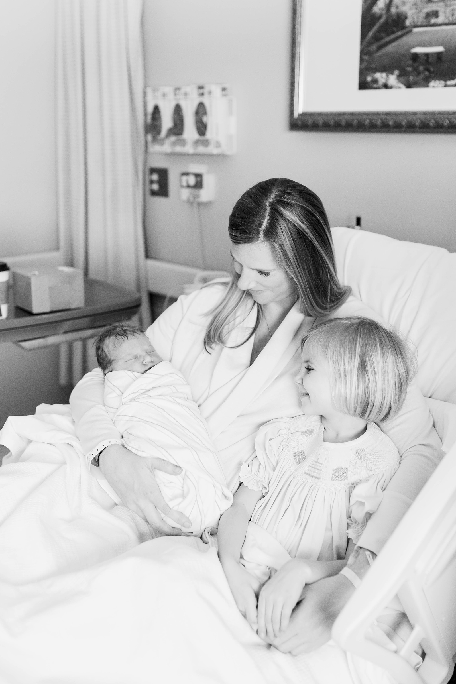 Mom with newborn and toddler during Fresh 48 session | Caitlyn Motycka Photography