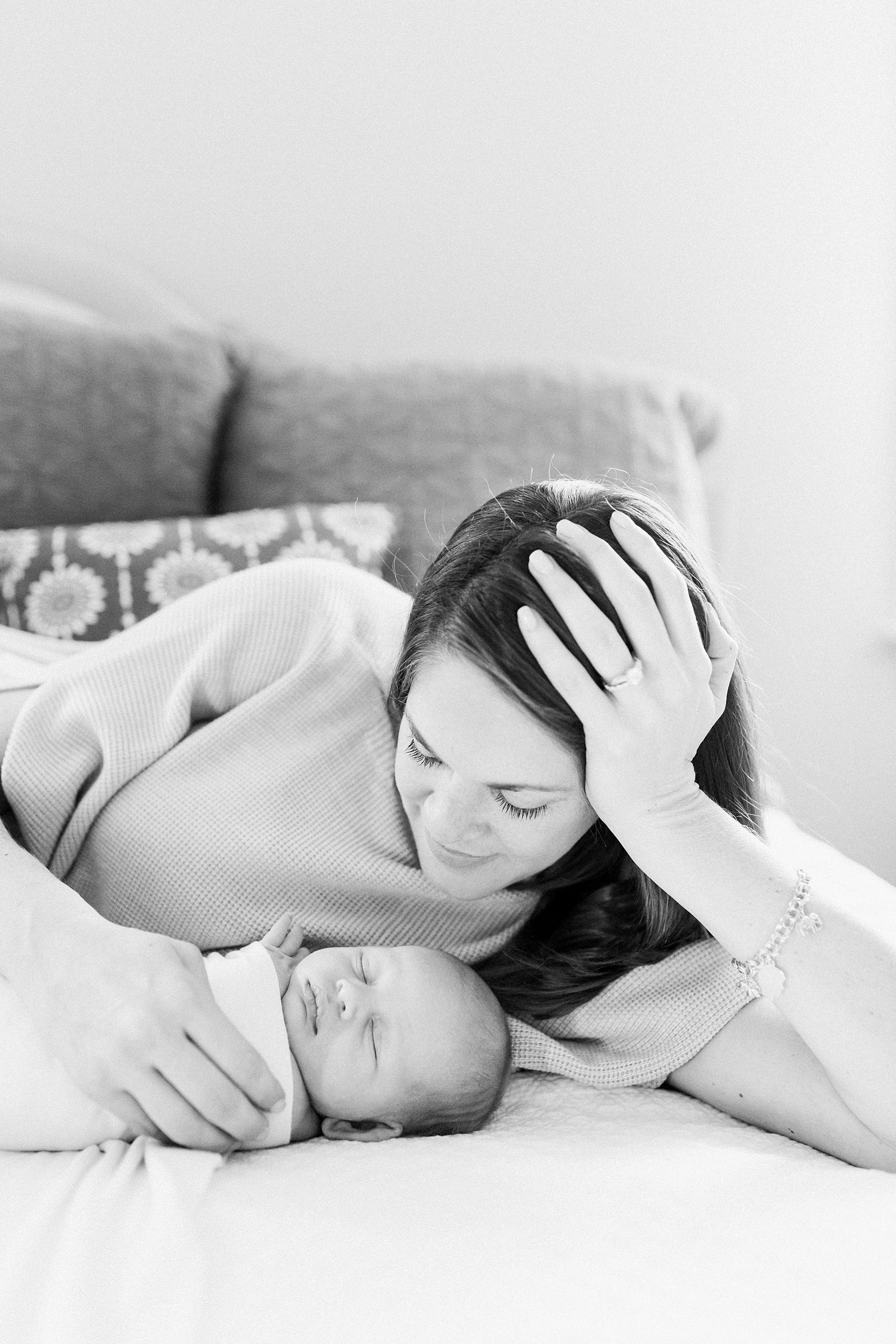 Black and white image of mom and baby by Mount Pleasant lifestyle newborn photographer, Caitlyn Motycka Photography