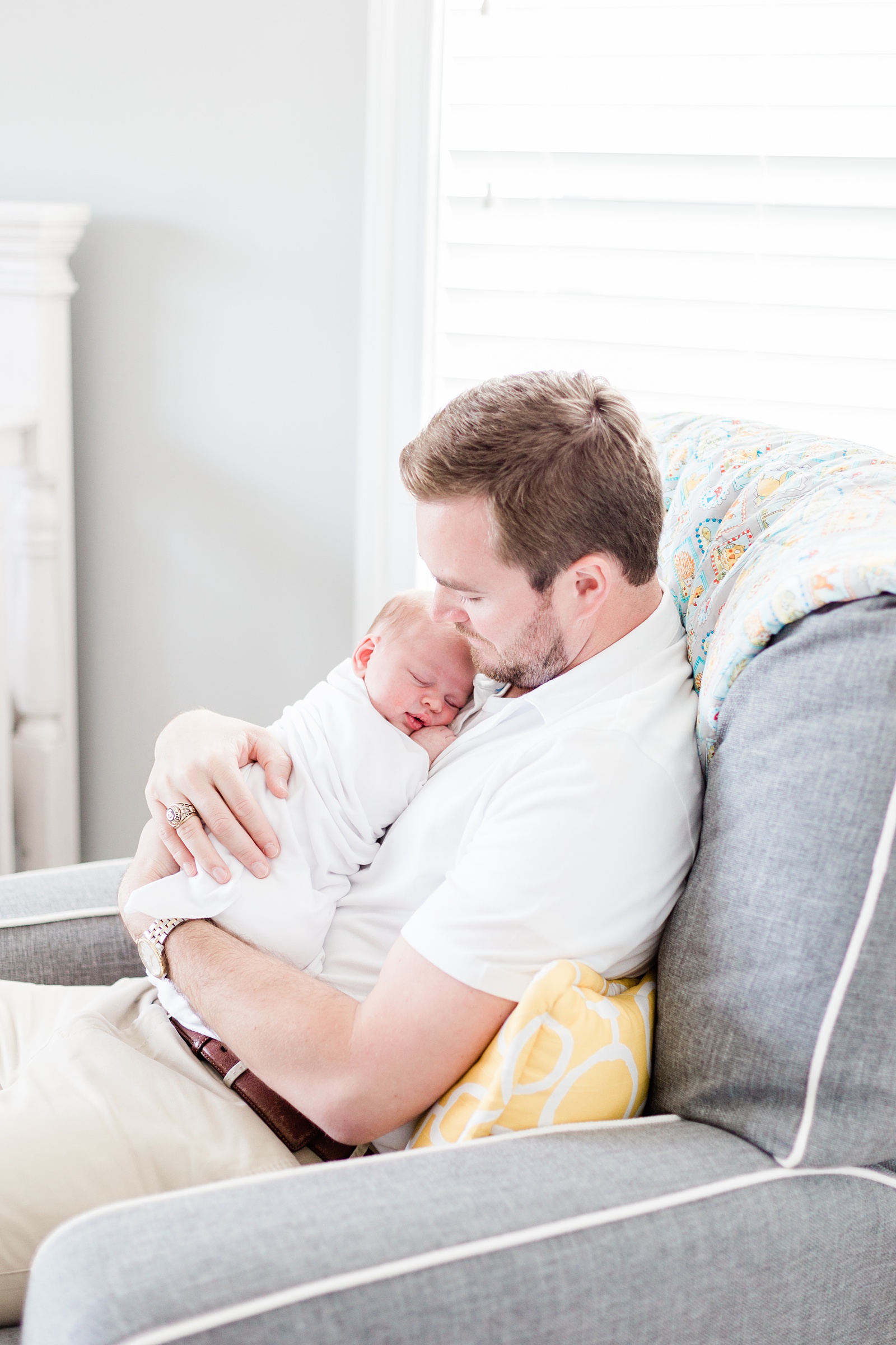 Dad rocking baby in Mount Pleasant, SC lifestyle newborn session | Caitlyn Motycka Photography