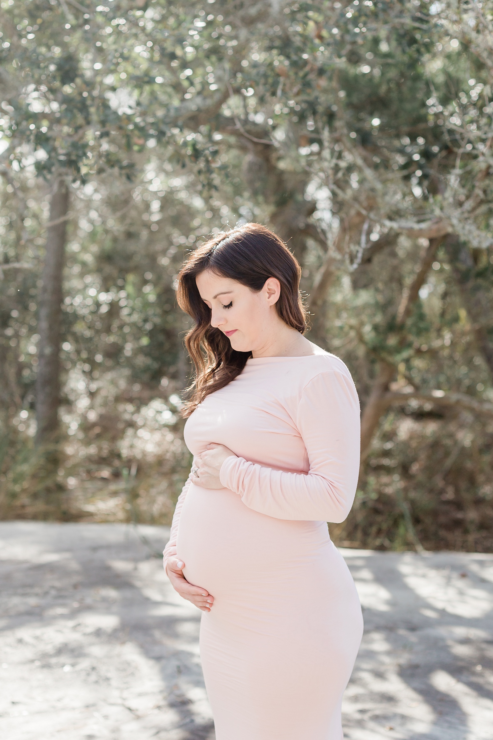 Beach Maternity session with mom in pink maxi dress by Caitlyn Motycka Photography