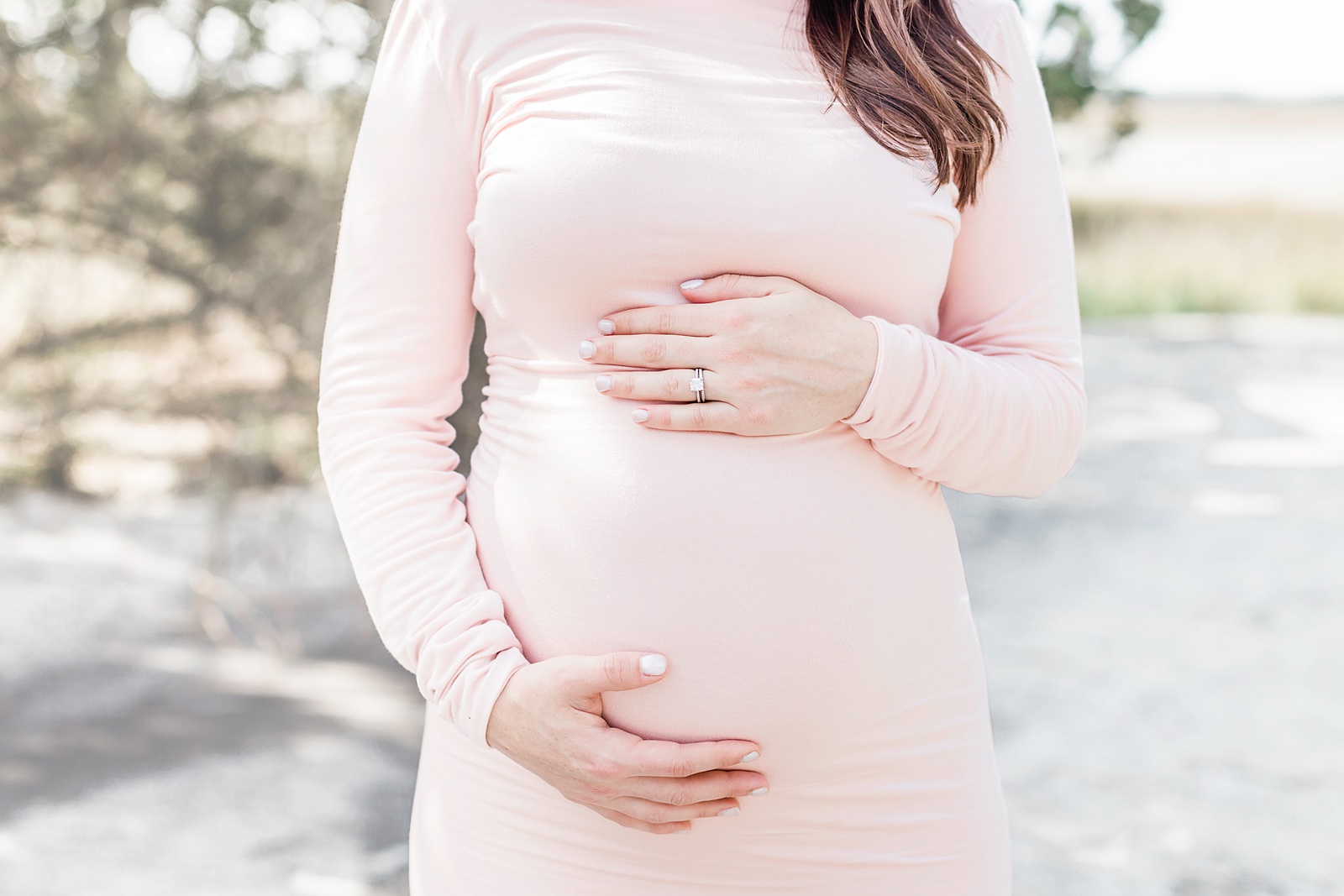 Close up of baby bump during maternity session on Folly Beach | Caitlyn Motycka Photography