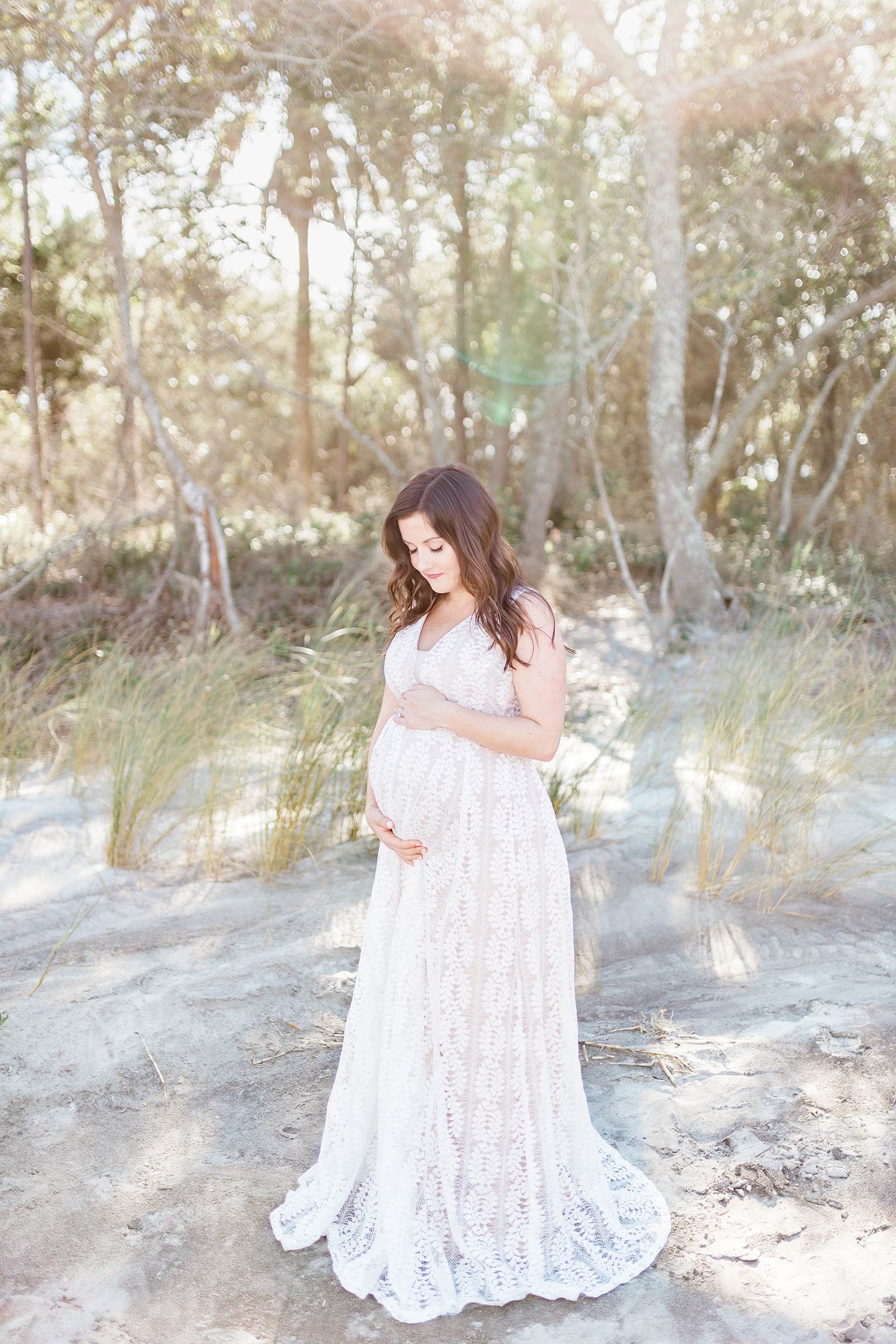 Expecting mom in Lulu's lace maxi dress during maternity session on Folly Beach | Caitlyn Motycka Photography