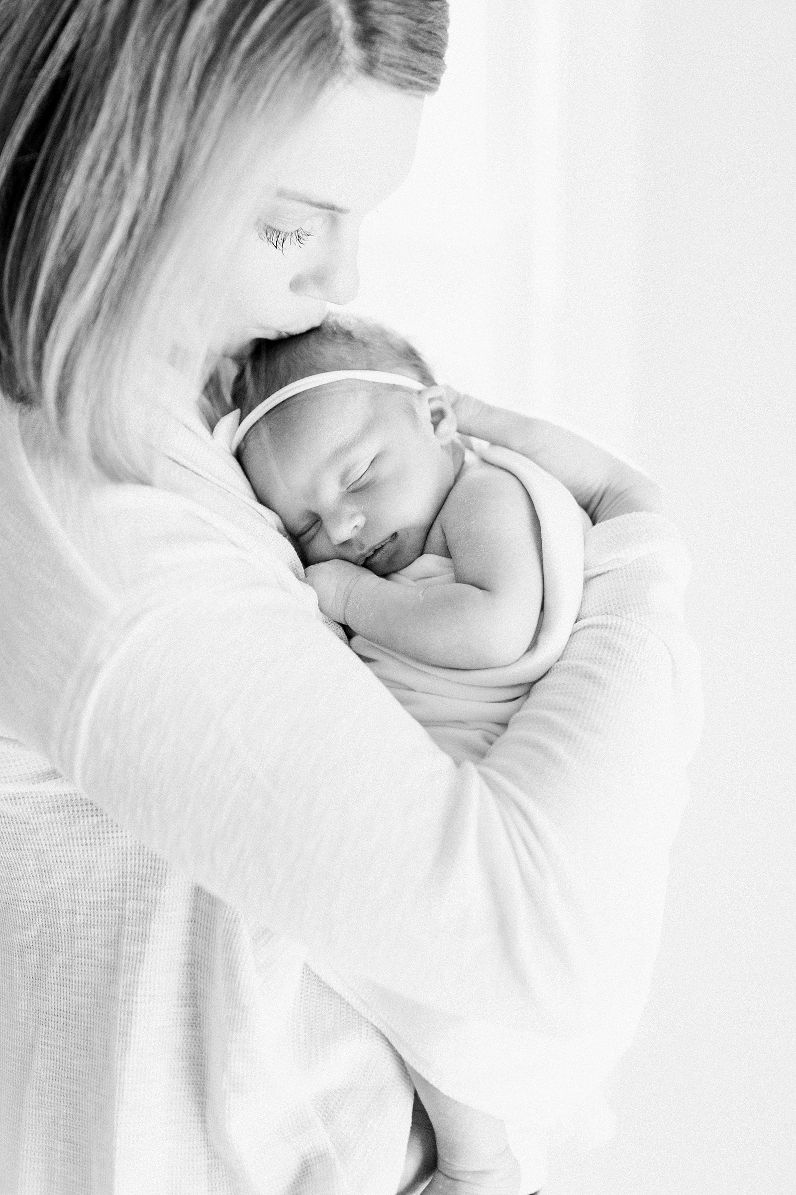 Black and white newborn image with Mom and baby in Charleston, SC | Caitlyn Motycka Photography