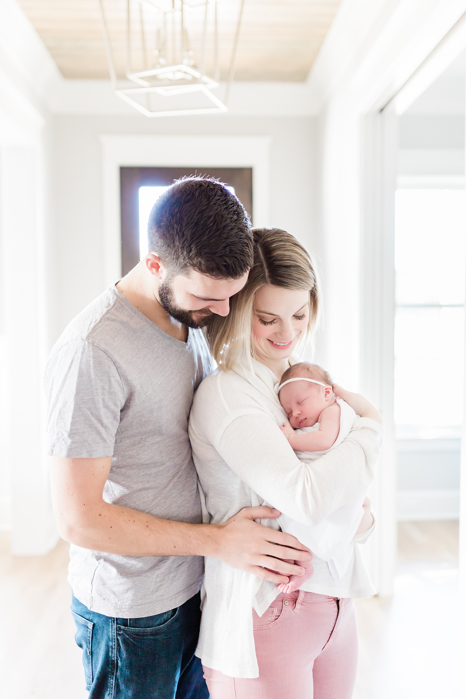 Family in entryway during Mount Pleasant Newborn session | Caitlyn Motycka Photography