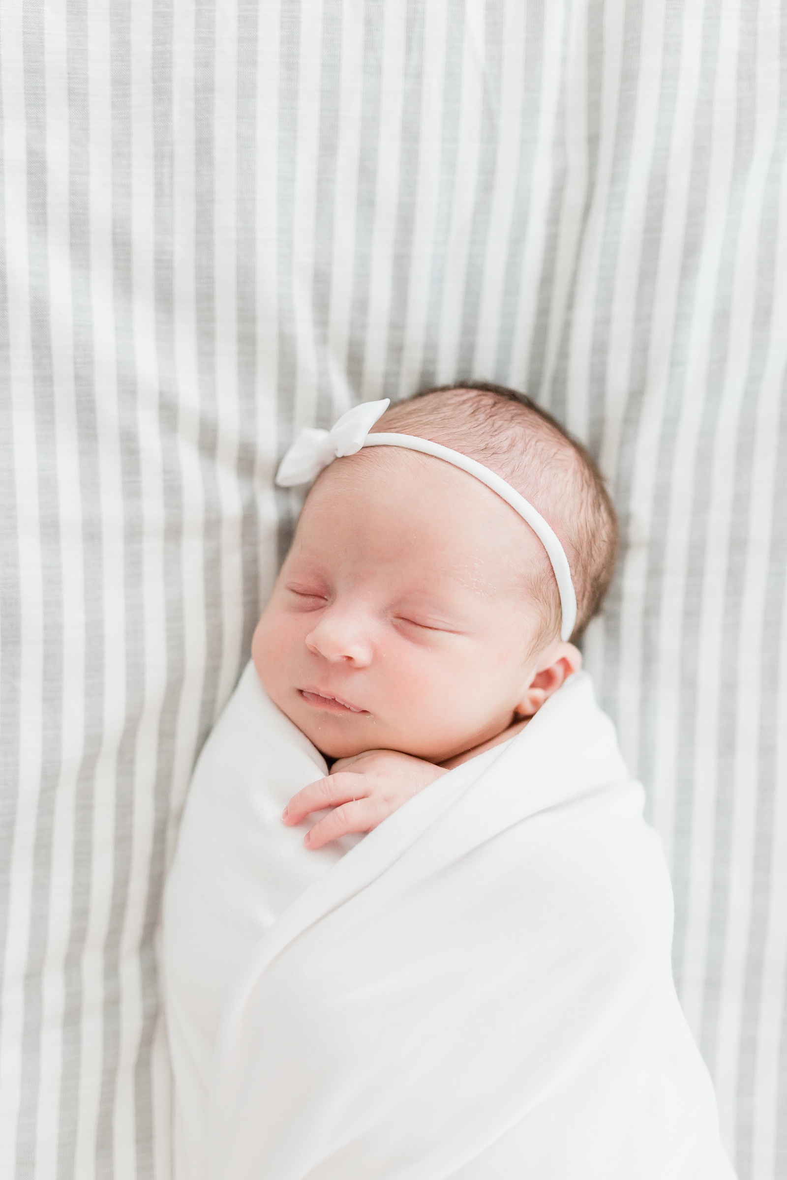Baby girl during lifestyle newborn session in Mount Pleasant, SC | Caitlyn Motycka Photography
