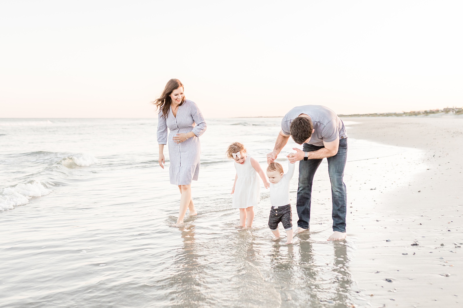Family playing in the water during family session on Isle of Palms beach | Caitlyn Motycka Photography