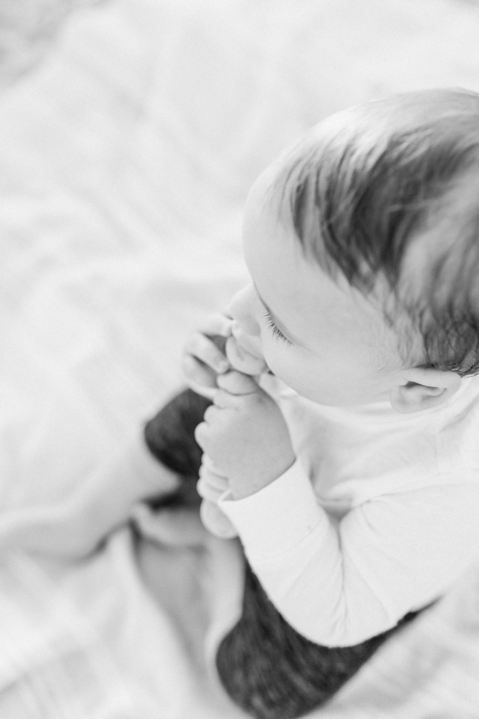 Black and white closeup of infant at Isle of Palms beach by Caitlyn Motycka Photography