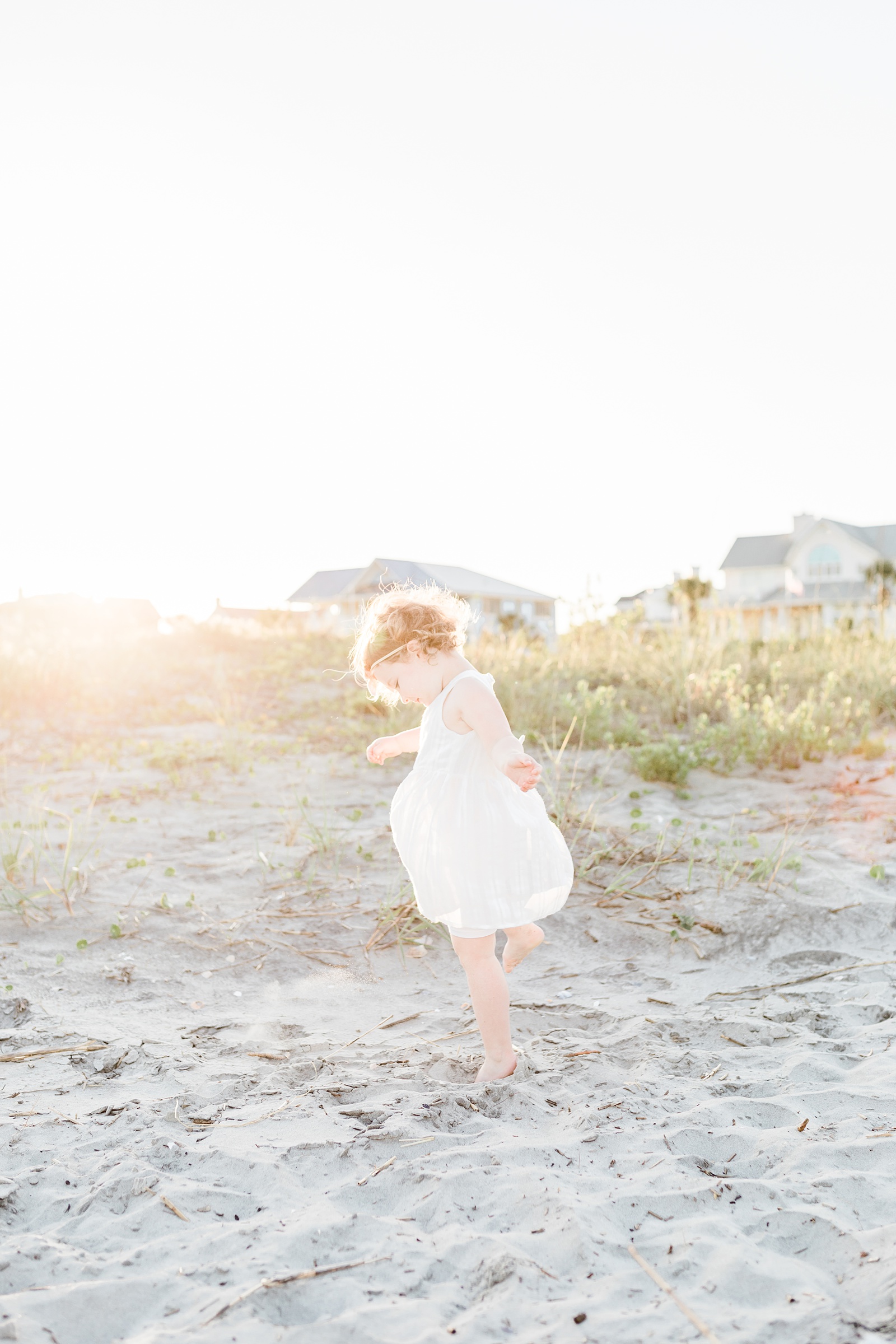 Little girl dancing during extended family session by Charleston Family Photographer, Caitlyn Motycka Photography