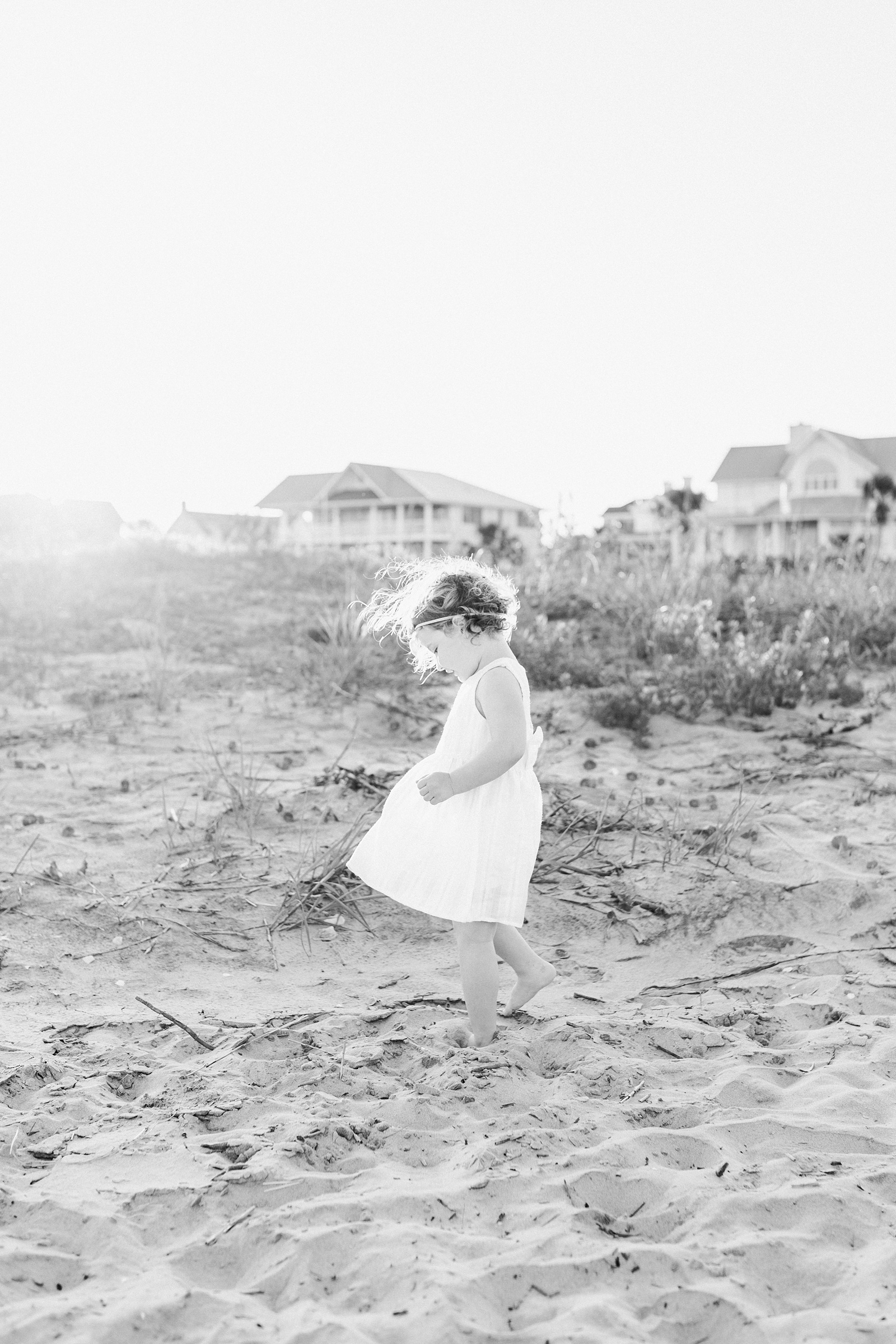 Little girl in black and white on Isle of Palms during family session by Caitlyn Motycka Photography