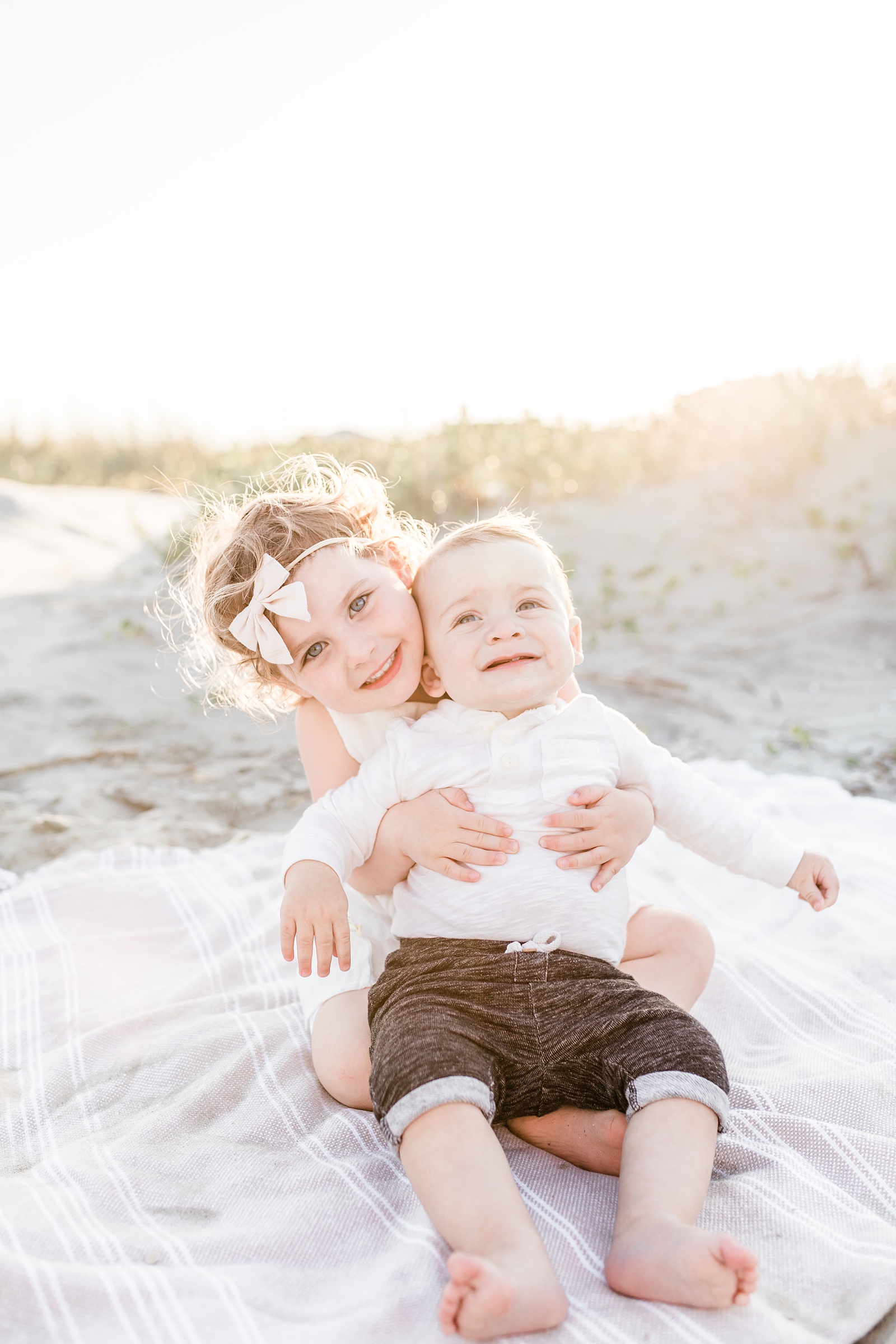 Siblings during sunset beach session on Isle of Palms outside of Charleston by Caitlyn Motycka Photography
