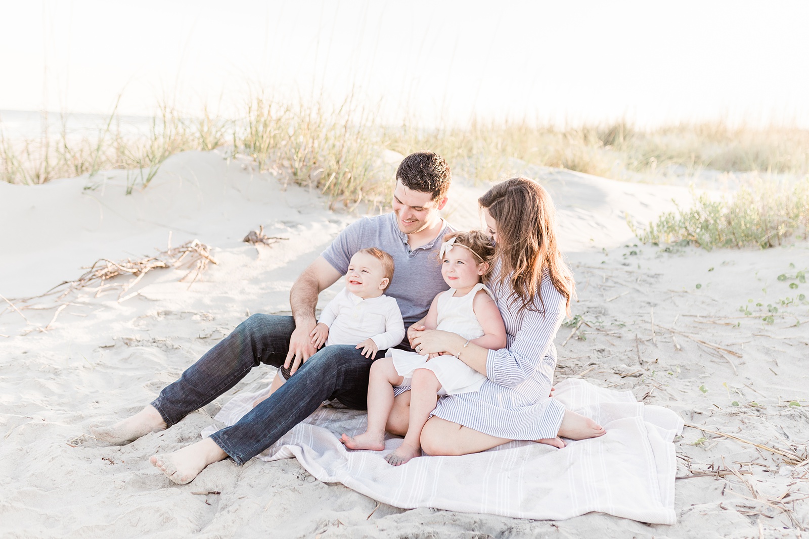 Family on blanket at Isle of Palms beach outside of Charleston, SC | Caitlyn Motycka Photography