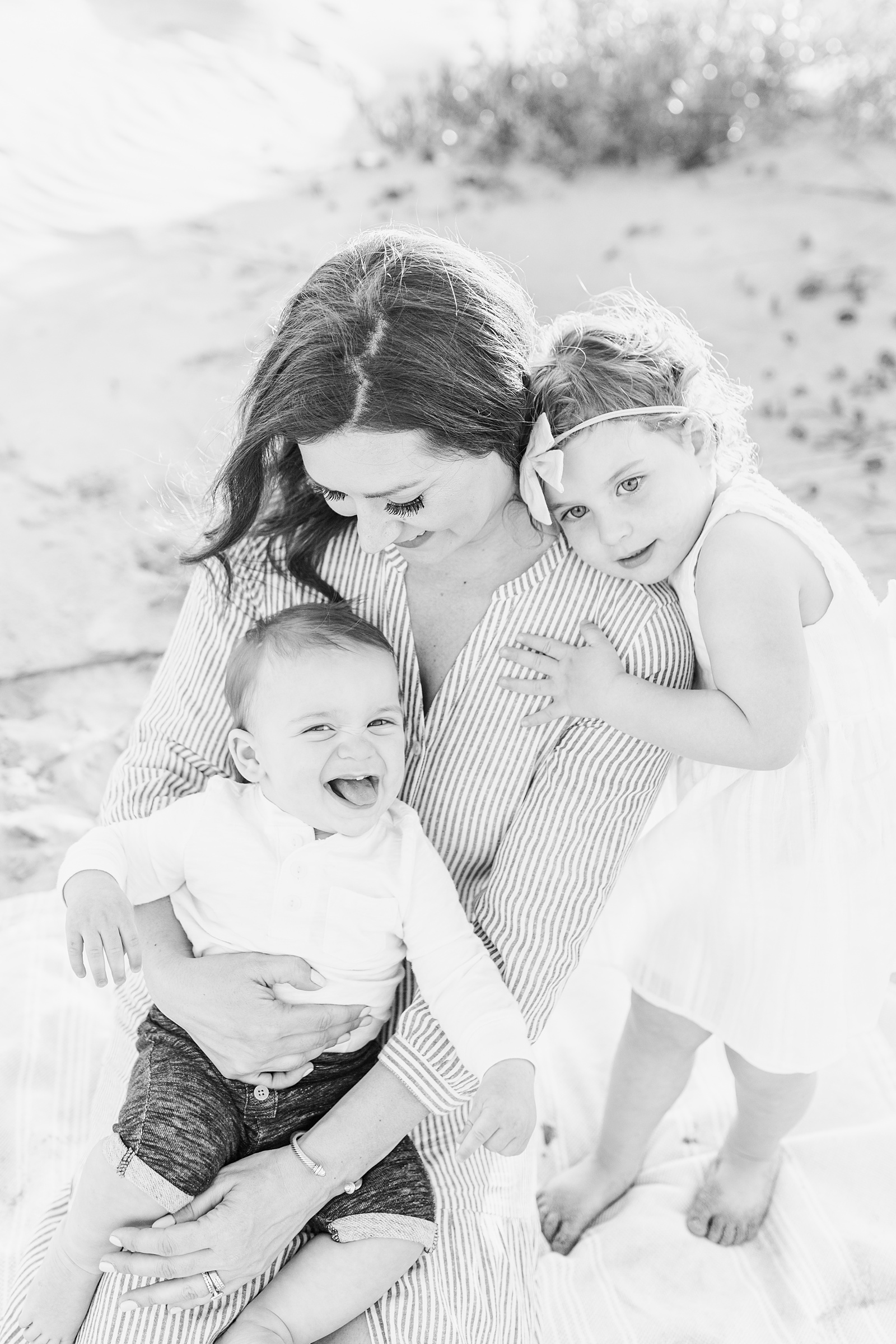 Mom and her kids on Isle of Palms beach by Charleston Family Photographer, Caitlyn Motycka Photography