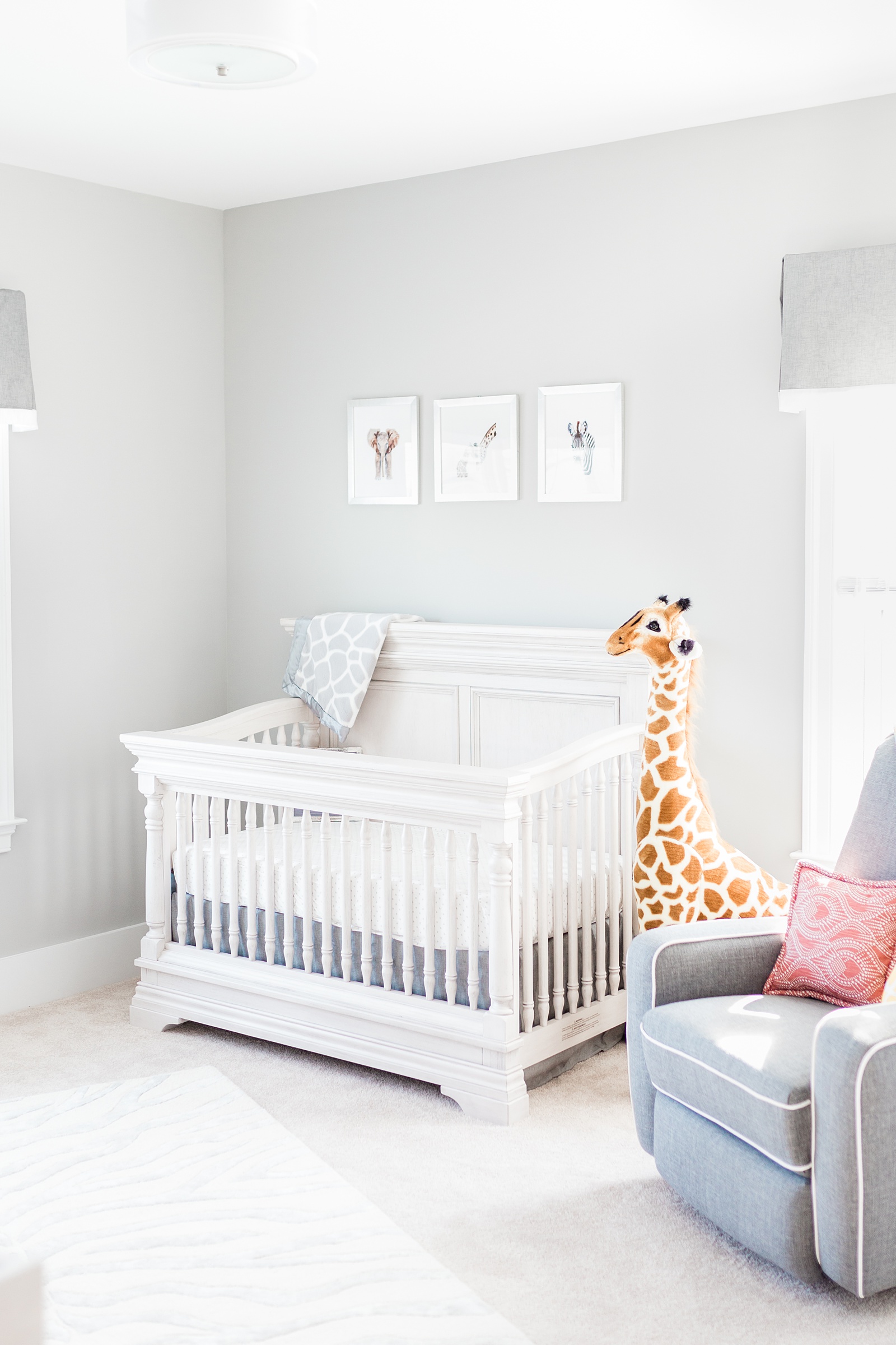 Grey nursery details with safari theme during lifestyle newborn session by Charleston newborn photographer, Caitlyn Motycka Photography