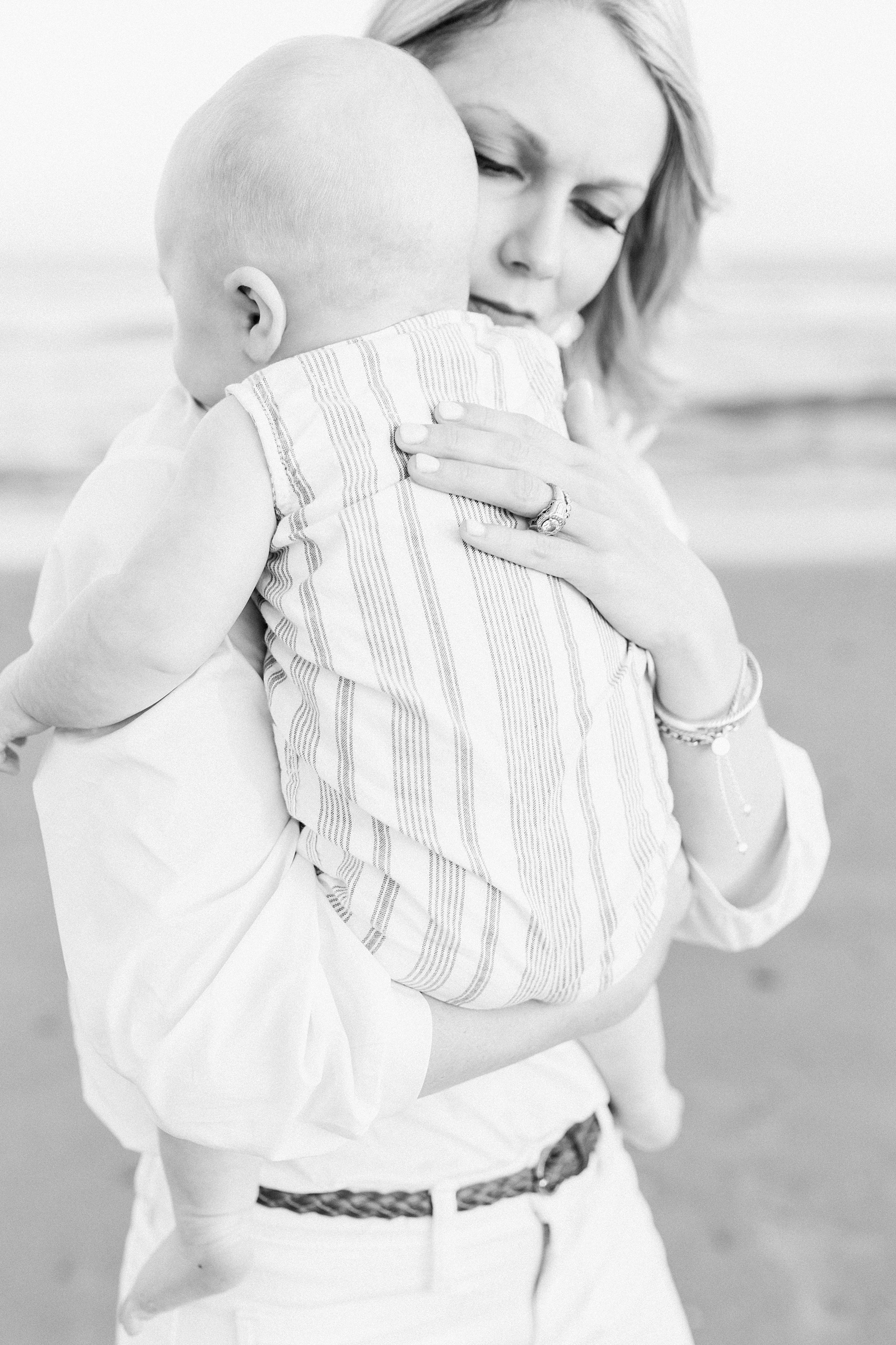 Black and white image of mom and baby by Charleston Family Photographer, Caitlyn Motycka Photography