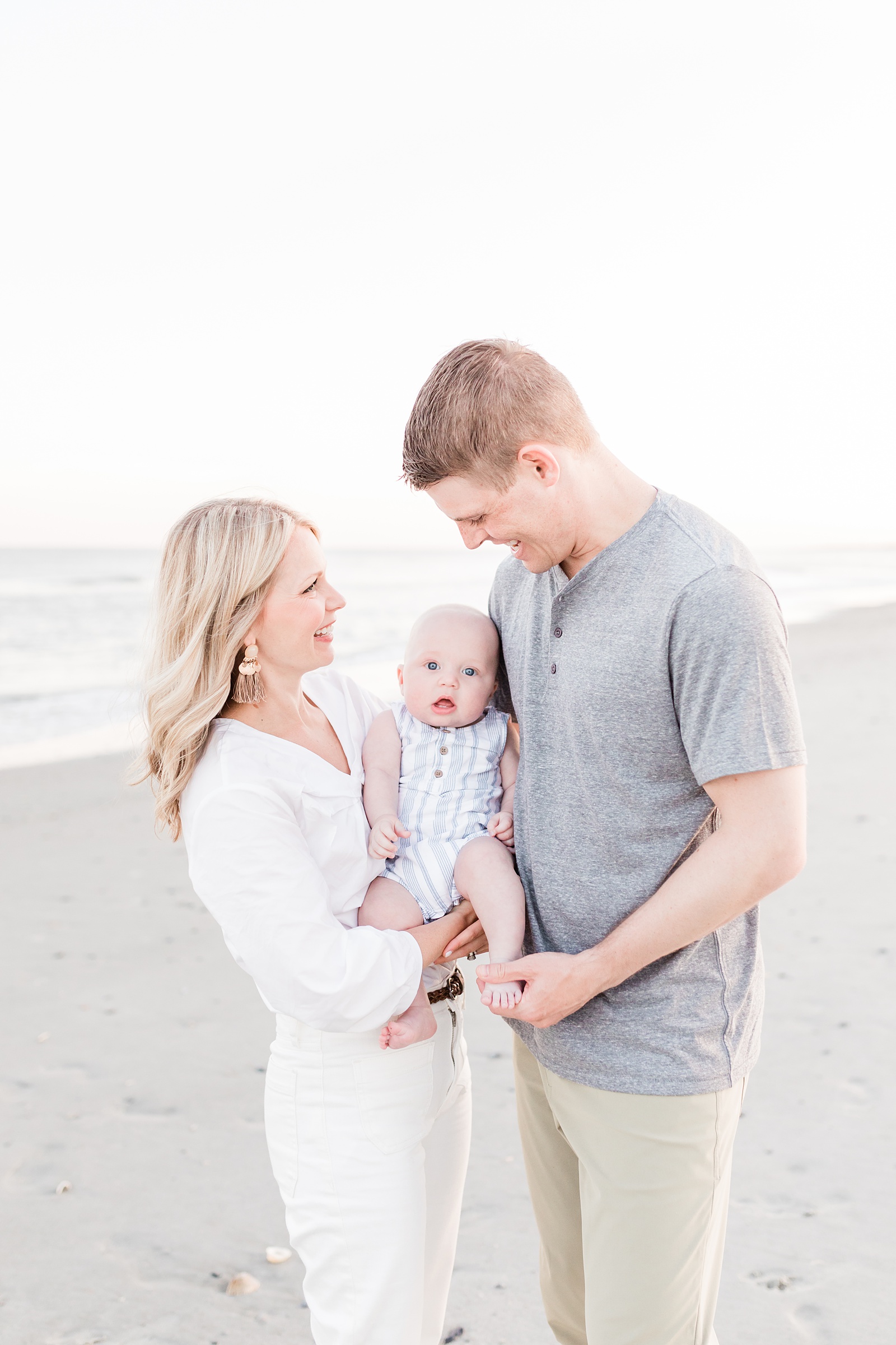Family with baby on the beach by Charleston Family Photographer, Caitlyn Motycka Photography