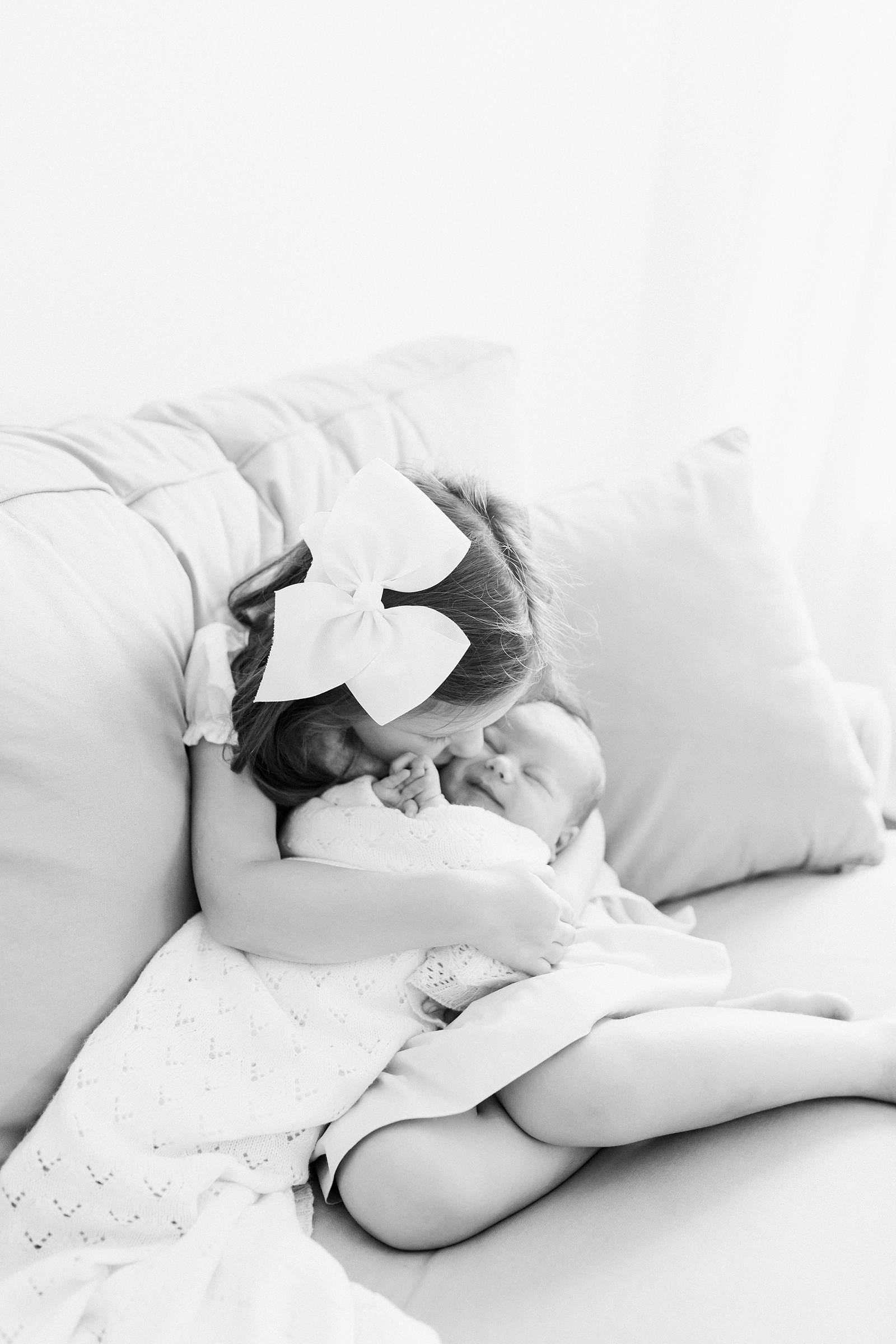 Big sister with baby brother by Caitlyn Motycka Photography