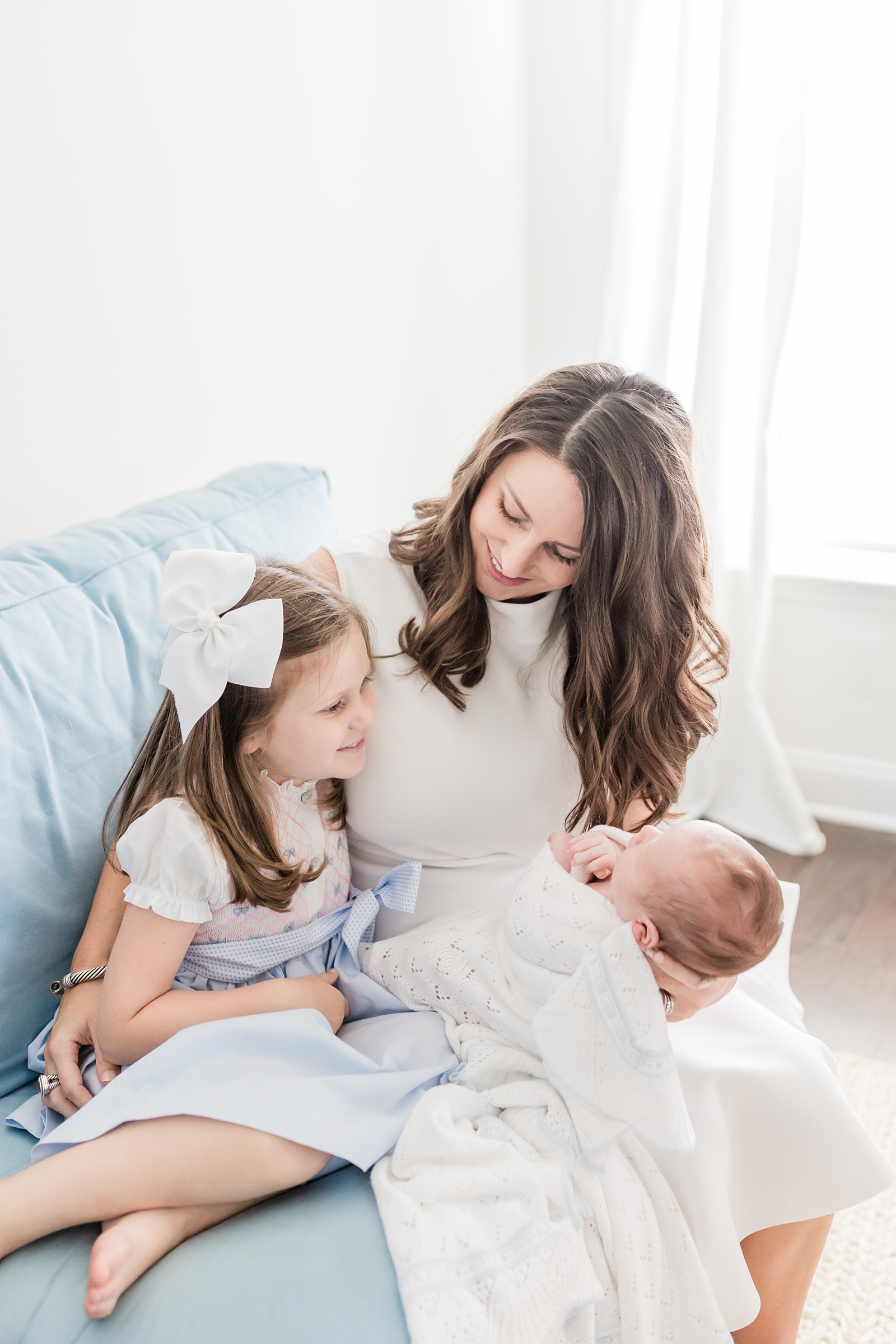 Mom with toddler and baby lifestyle newborn session by Caitlyn Motycka Photography