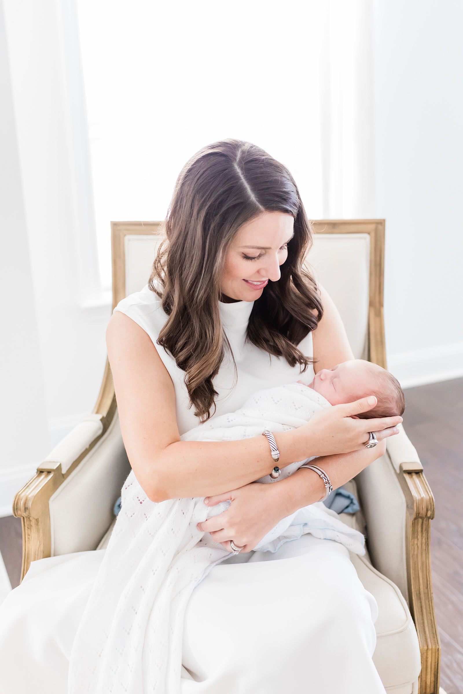 Classic and southern Mom with baby boy during lifestyle newborn session | Caitlyn Motycka Photography
