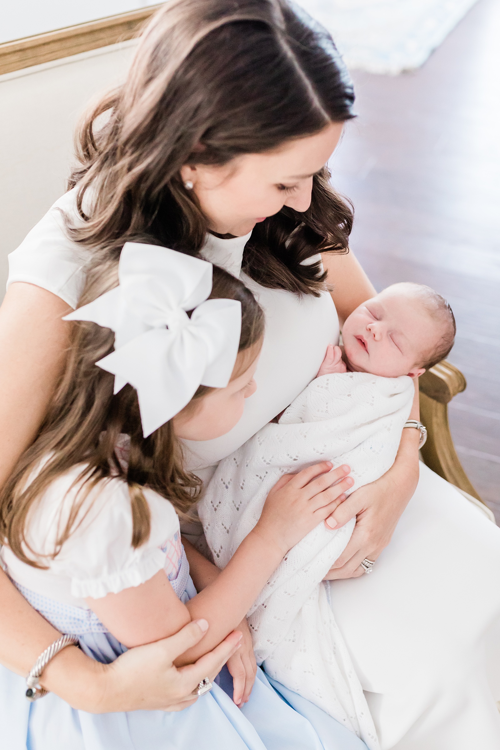 Big sister with mom and baby brother during newborn session by Charleston Newborn Photographer, Caitlyn Motycka Photography