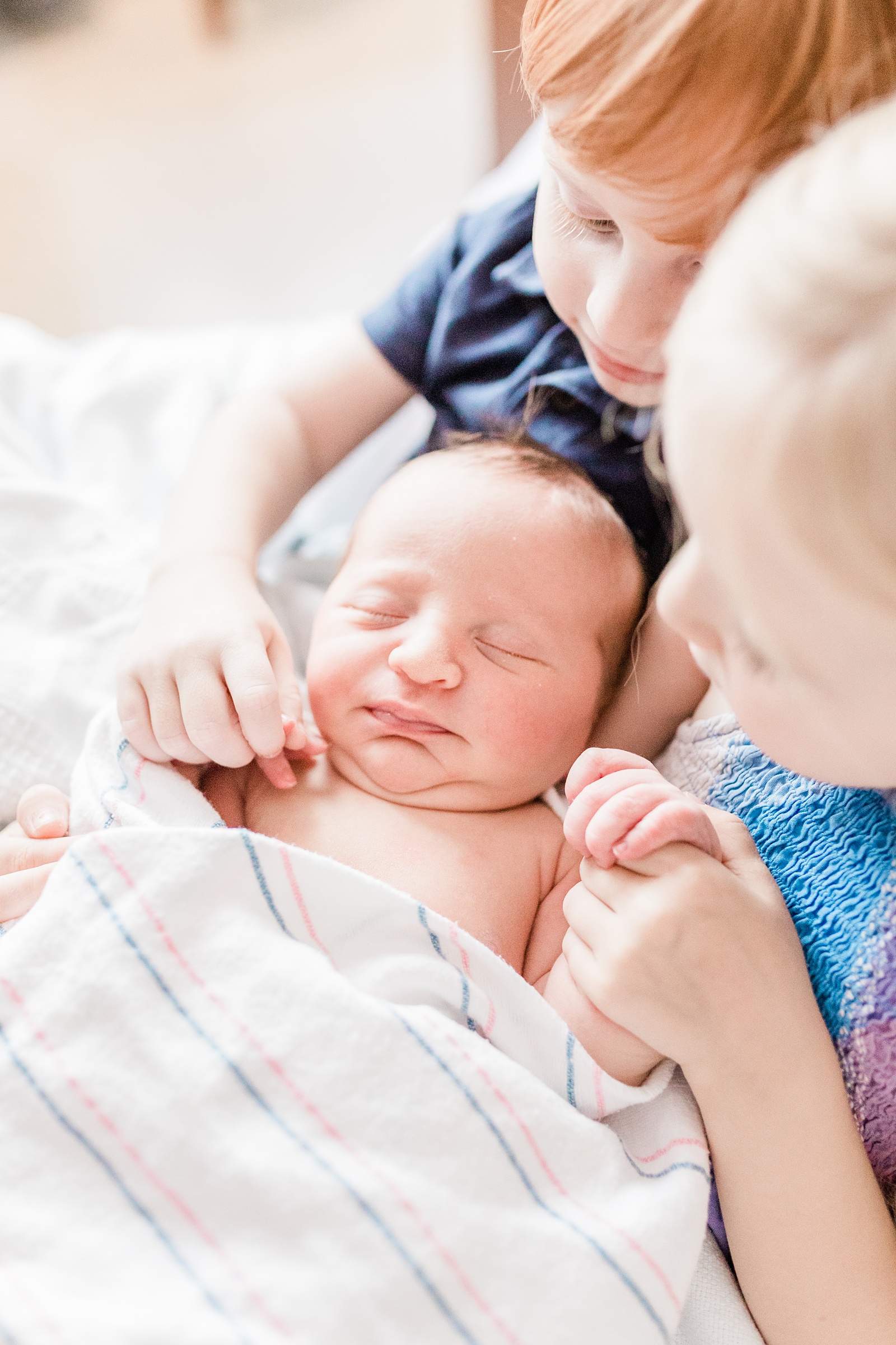 Siblings holding baby during Charleston Fresh 48 session | Caitlyn Motycka Photography