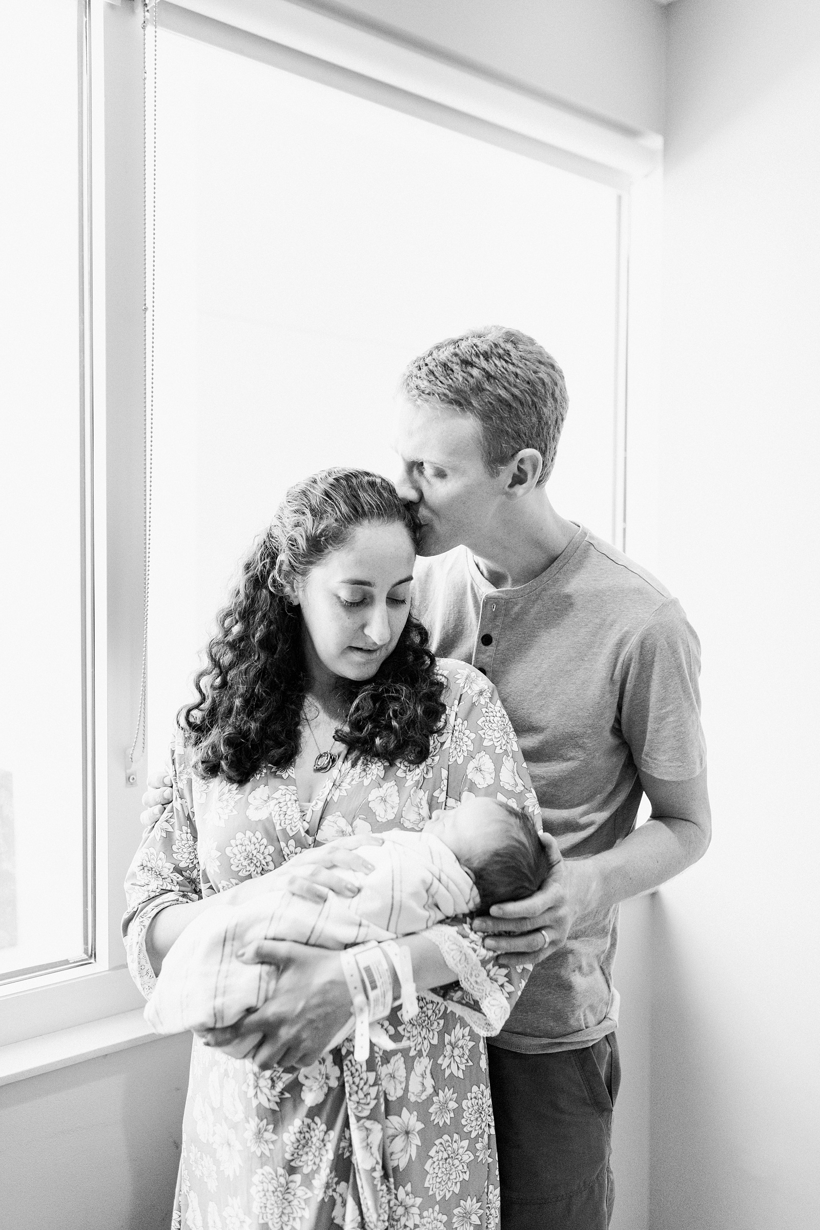 Black and white image of parents with newborn in hospital | Caitlyn Motycka Photography