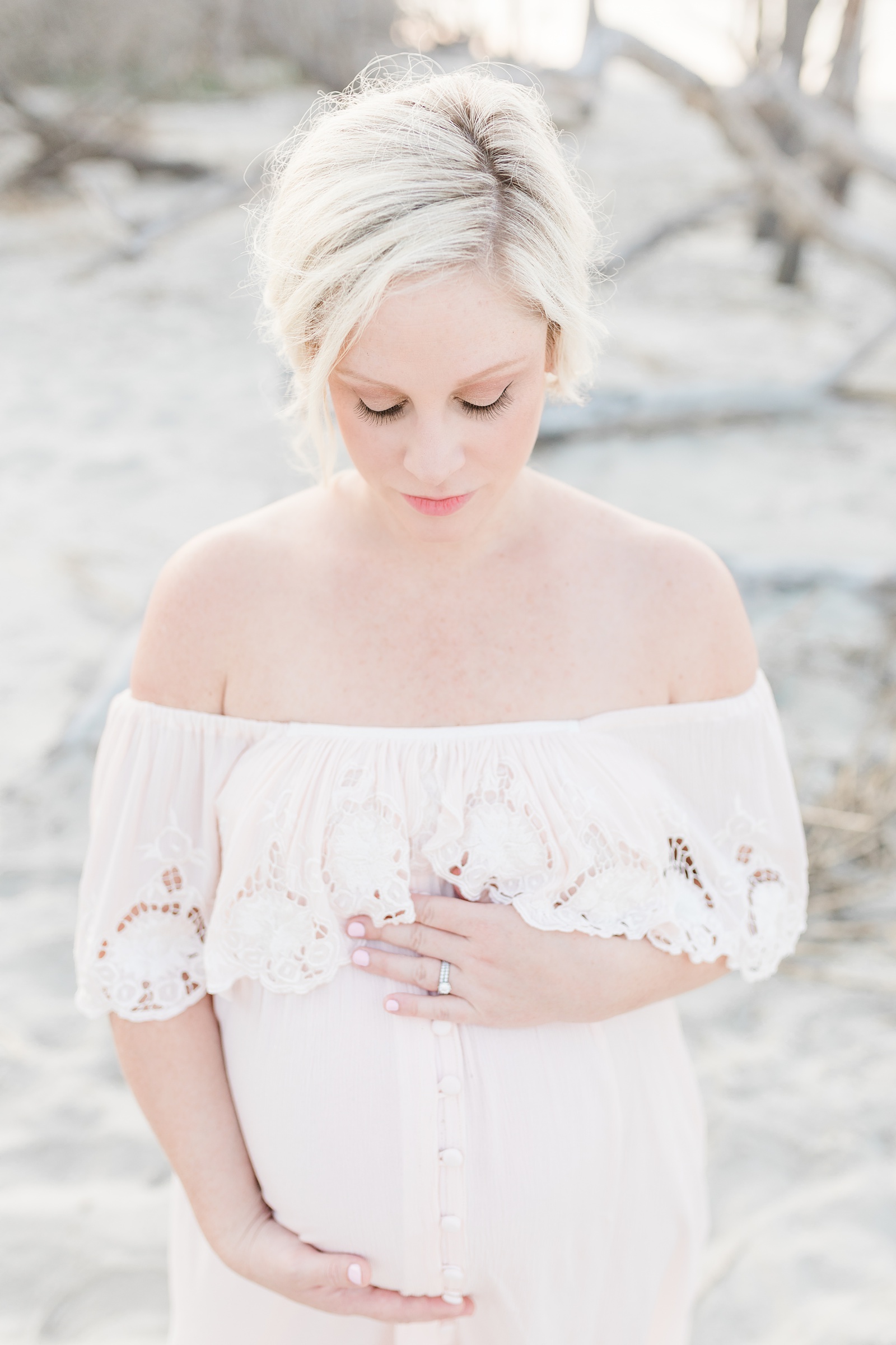 Mom wearing blush Fillyboo dress for beach maternity session by Caitlyn Motycka Photography
