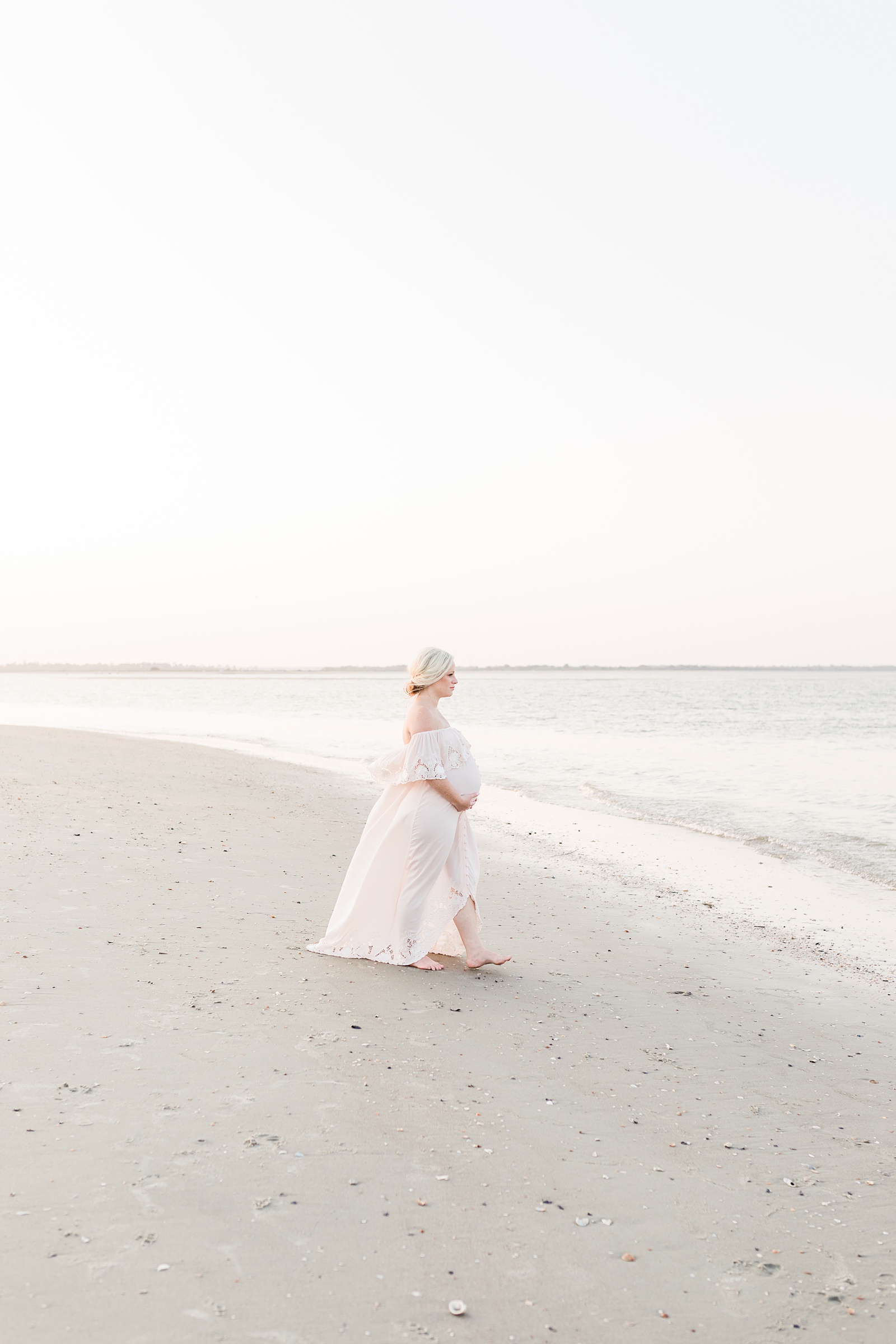 Beach maternity photo with mom in lace maxi dress by Caitlyn Motycka Photography