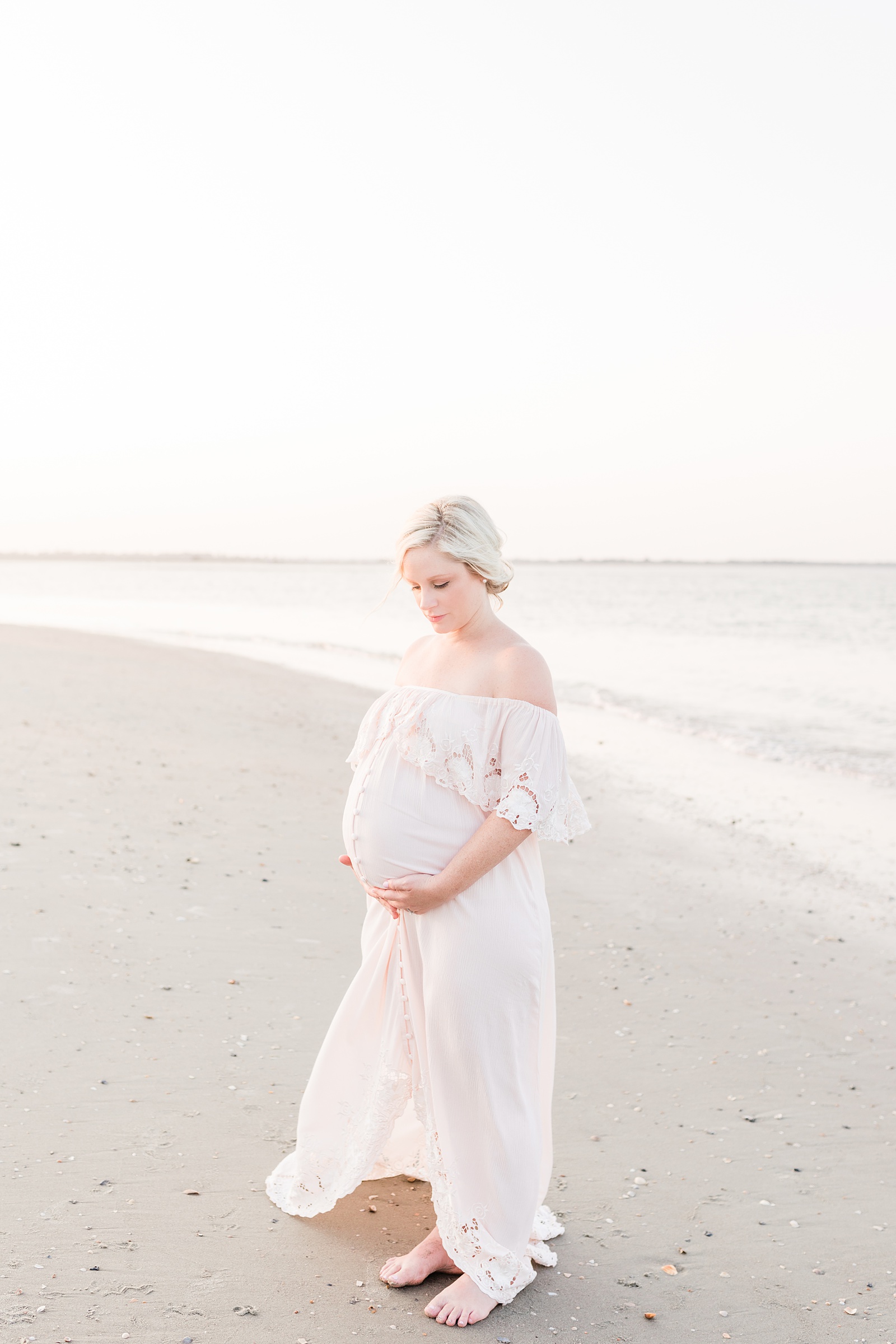 Sunset beach maternity session with mom in blush maxi dress by Caitlyn Motycka Photography