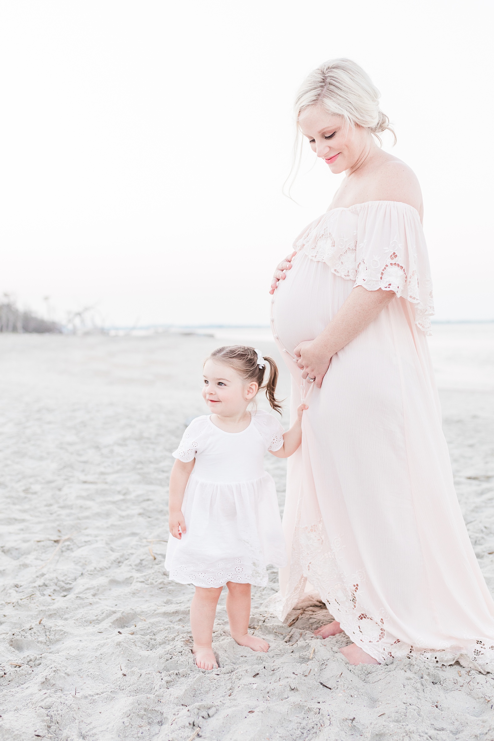 Mom and toddler during sunset maternity session on Folly Beach by Charleston Family Photographer, Caitlyn Motycka Photography