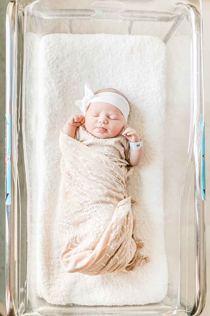 Fresh 48 hospital newborn photo of baby girl in bassinet. Photos by Charleston Fresh 48 Photographer, Caitlyn Motycka Photography.