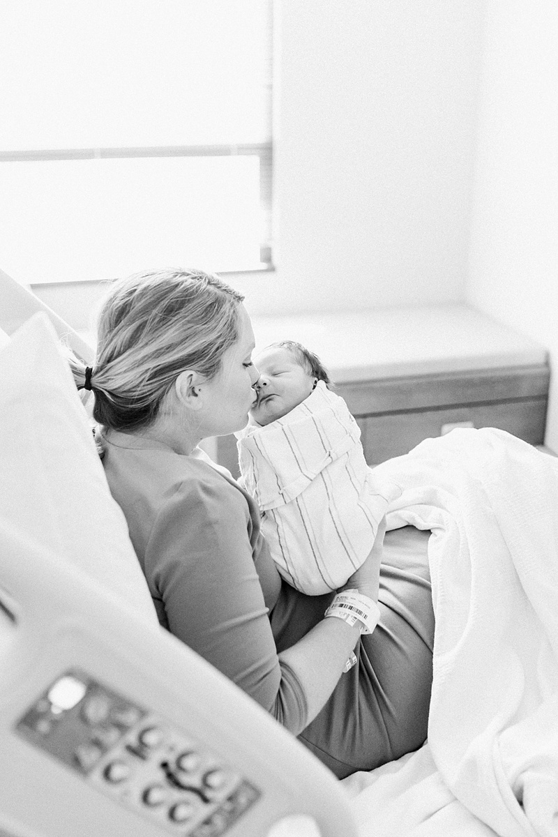 Black and white photo of Mama and baby boy during Fresh 48 Hospital Newborn Session at Roper St. Francis | Caitlyn Motycka photography