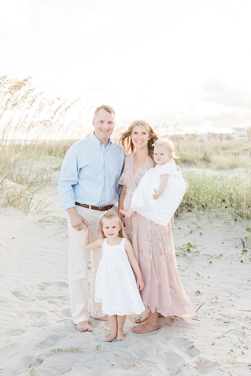 Family takes maternity photos at Isle of Palms Beach while on vacation in Charleston, SC. Photos by Charleston Family Photographer, Caitlyn Motycka Photography. 