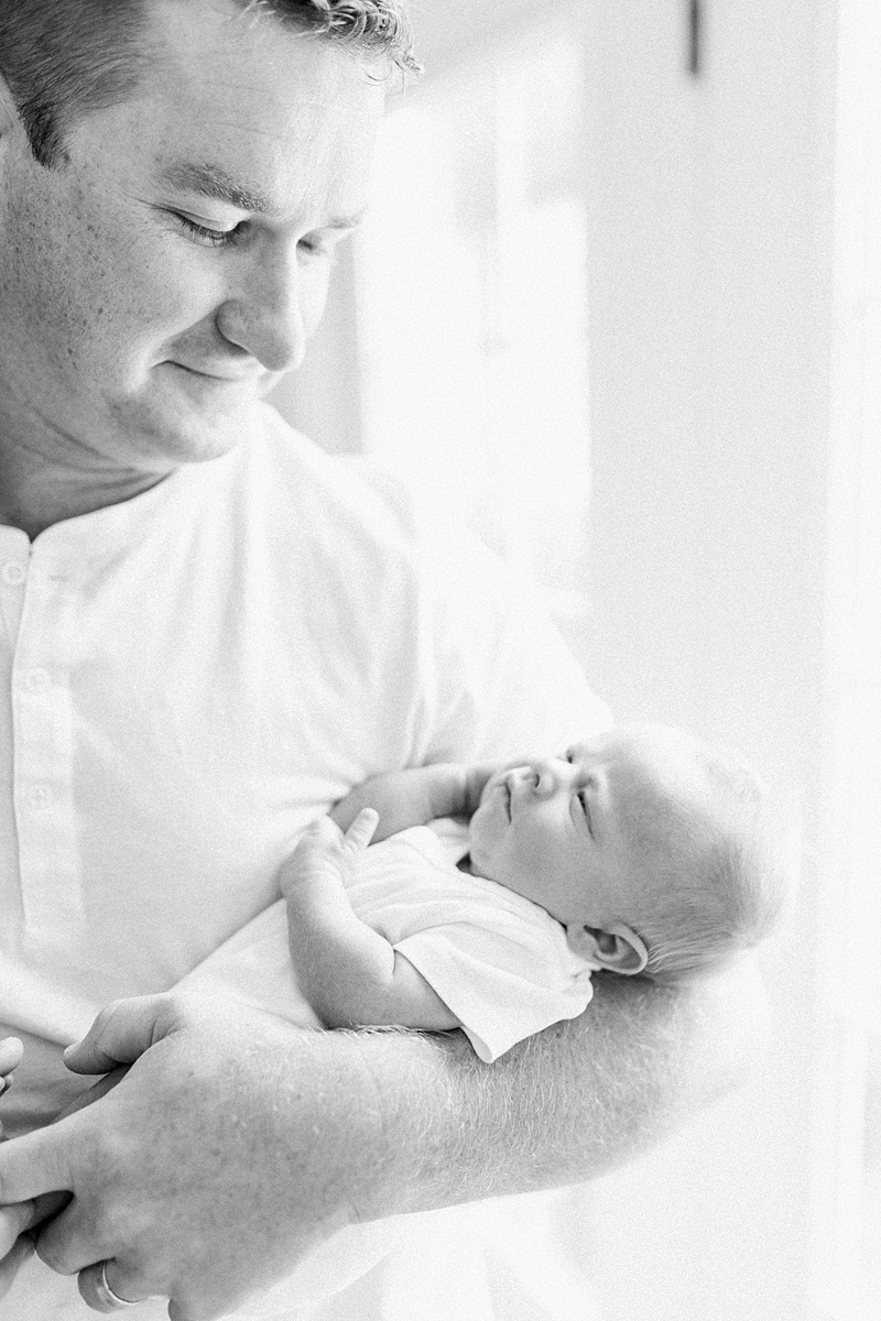 Father and son photo at lifestyle newborn session. Photos by Daniel Island Newborn Photographer, Caitlyn Motycka Photography. 