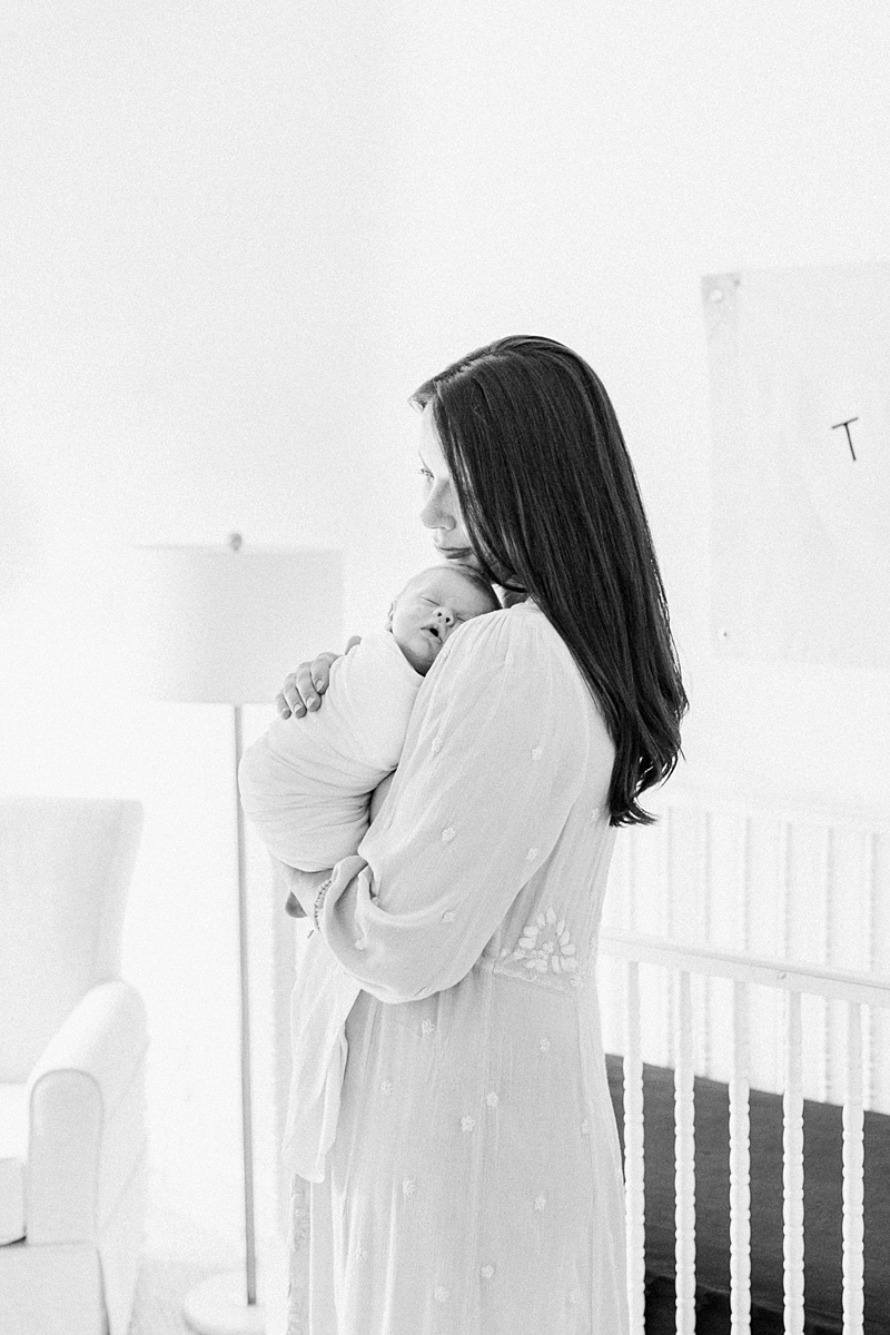 Black and white motherhood photo during Daniel Island lifestyle newborn session with Caitlyn Motycka Photography. 