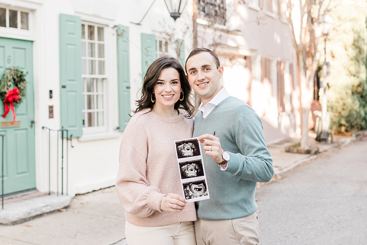 Pregnancy announcement photos in Downtown Charleston, SC. Photos by Charleston Newborn and Family Photographer, Caitlyn Motycka Photography. 