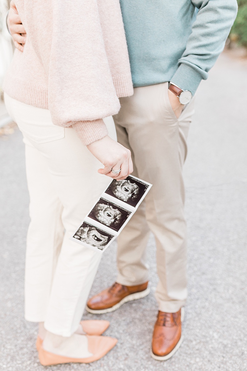 Pregnancy announcement photos in Downtown Charleston, SC. Photos by Charleston Newborn and Family Photographer, Caitlyn Motycka Photography. 