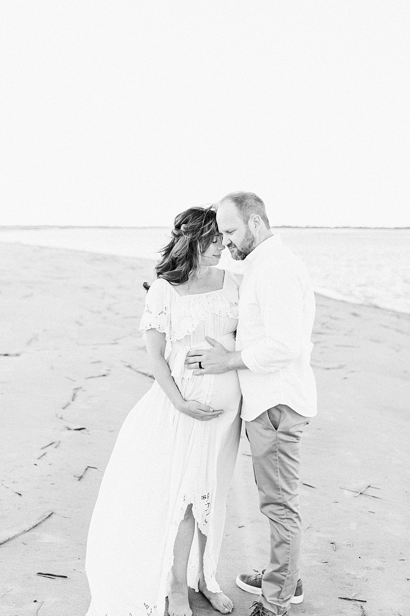 Black and white maternity photos on Folly Beach by Caitlyn Motycka Photography. 