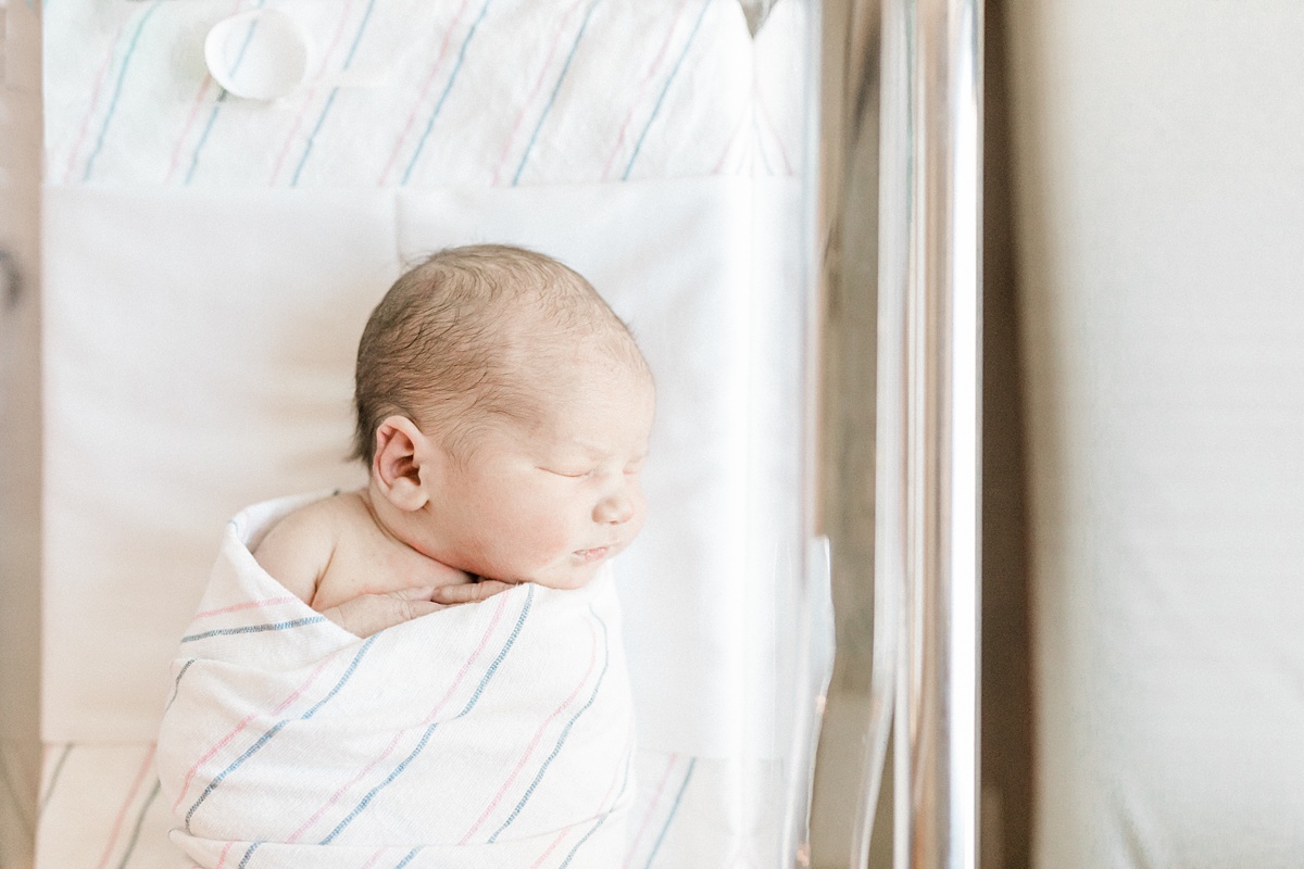 Baby swaddled in hospital bassinet. Photos by Charleston Fresh 48 Photographer, Caitlyn Motycka Photography.