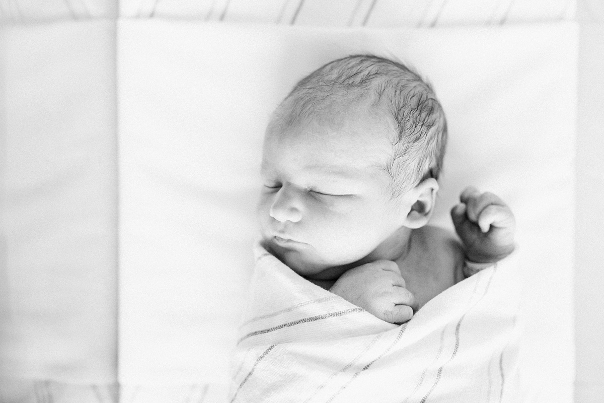 Black and white hospital newborn photo of baby in bassinet. Photos by Charleston Fresh 48 Photographer, Caitlyn Motycka Photography.