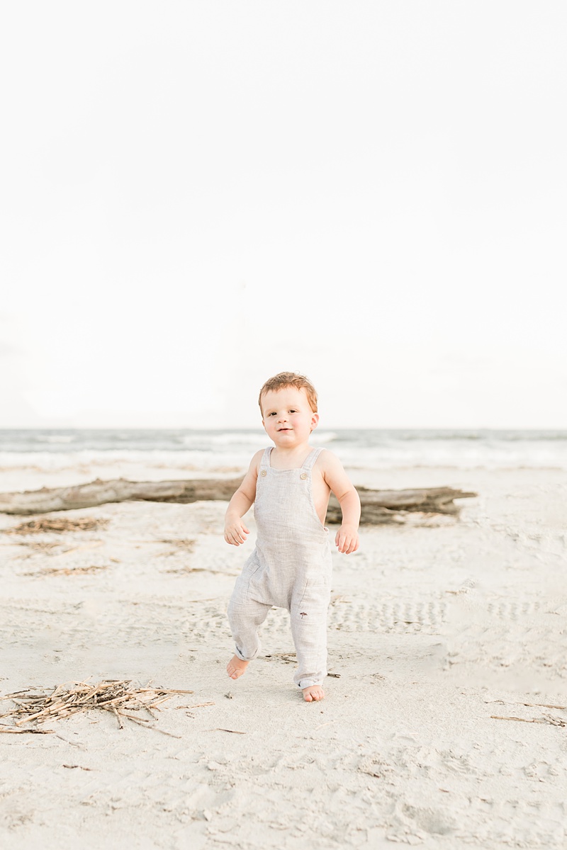 Cute toddler in Romper during beach family Session by Charleston Family Photographer, Caitlyn Motycka Photography