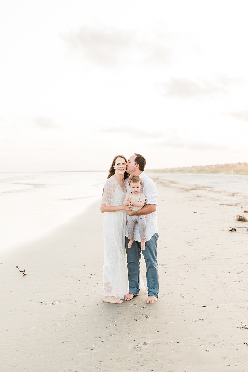 Family at sunset on beach by Caitlyn Motycka Photography