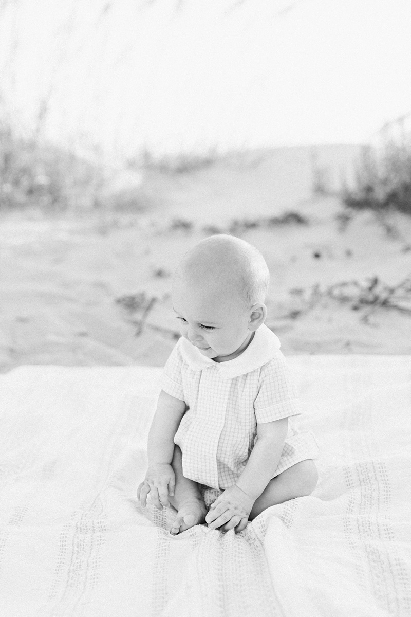 Black and white portrait of six month old baby boy during milestone photoshoot on Isle of Palms Beach | Caitlyn Motycka Photography 