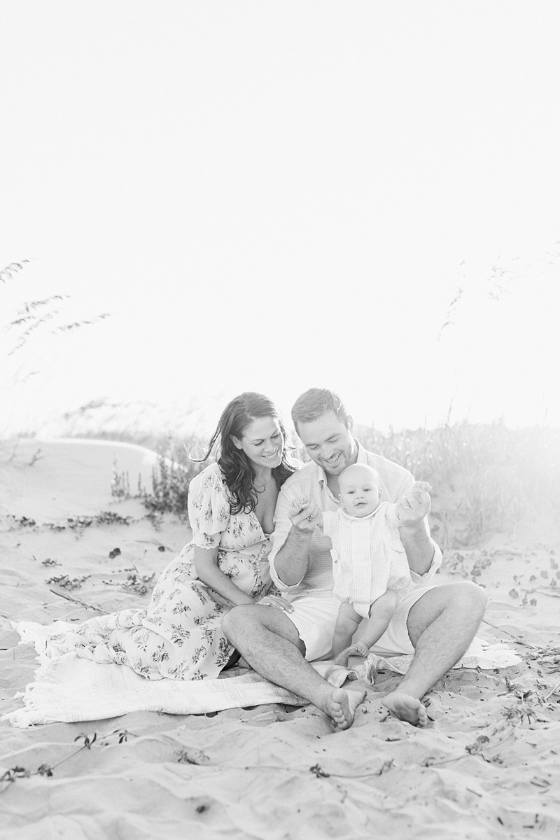 Black and white family photo on Isle of Palms Beach in Charleston, SC. Photos by Charleston Photographer, Caitlyn Motycka Photography. 