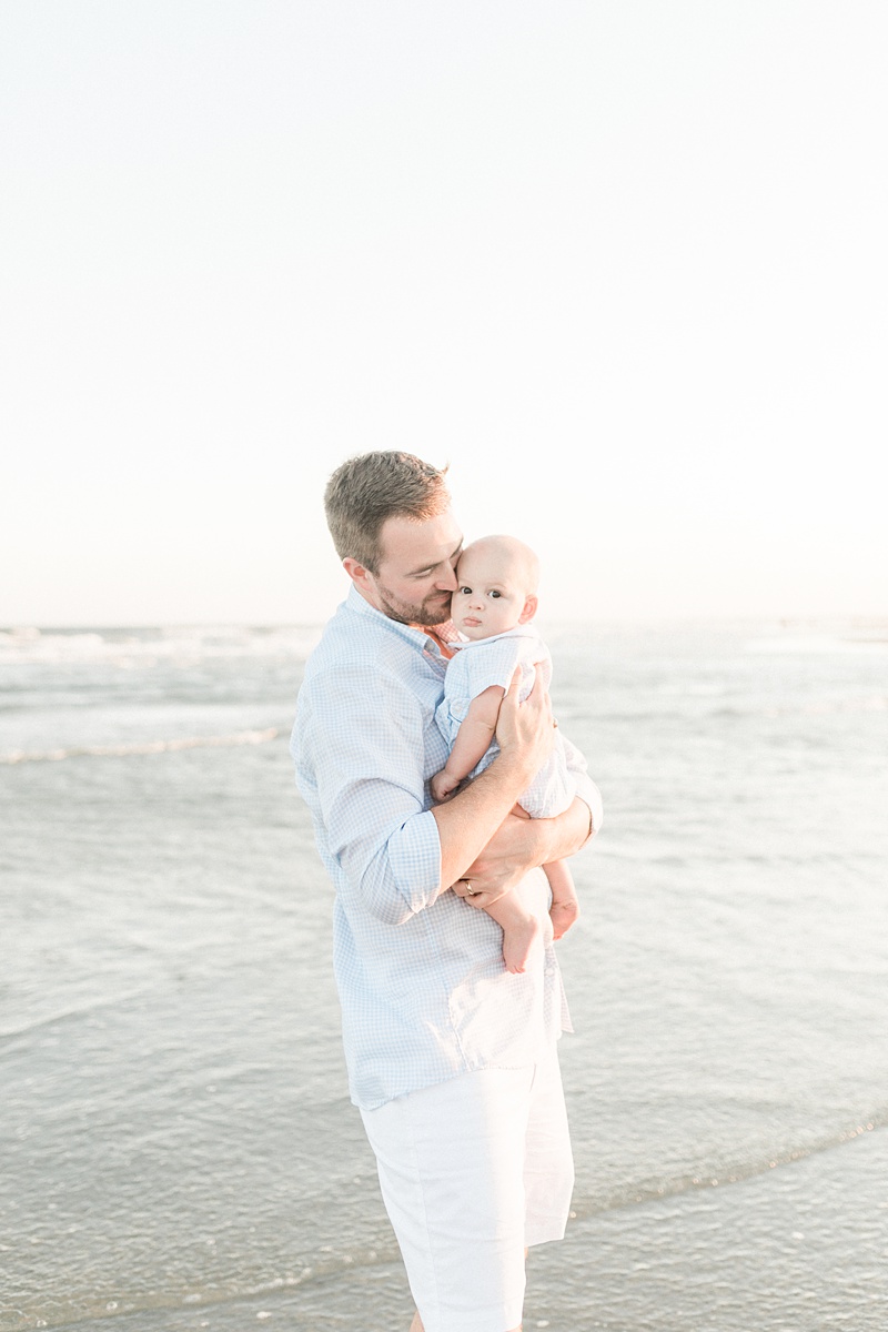 Father and son together on the beach during family photoshoot | Caitlyn Motycka Photography 